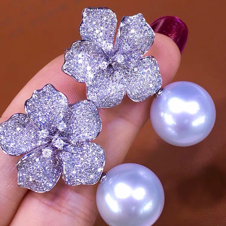 White pearl drop earrings set with masonry temperament earrings