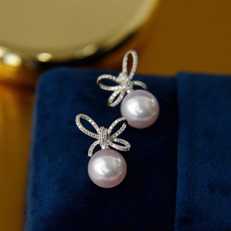 Pearl studs and diamond earrings