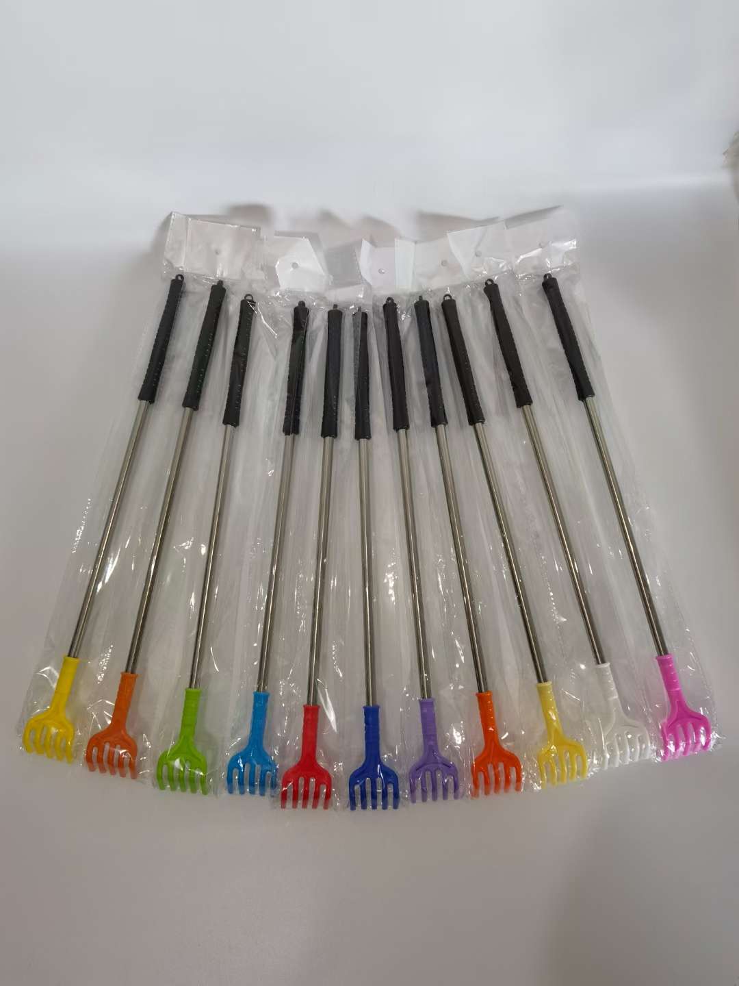 The black-handled back scratcher doesn't require someone to scratch the itch detail image 4