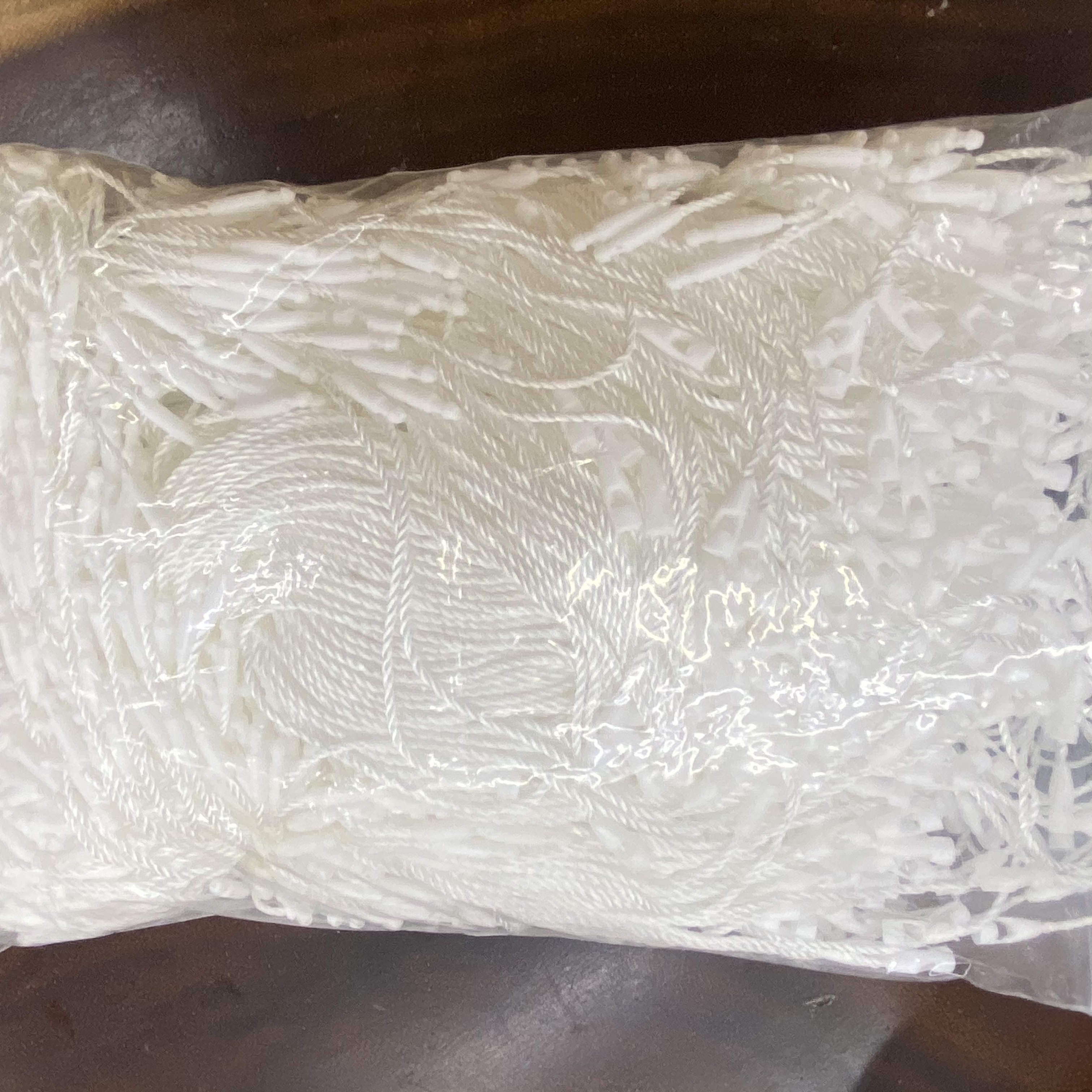 短纤/不干胶码贴/挂绳吊牌绳/隔断珍珠链/服装吊牌产品图