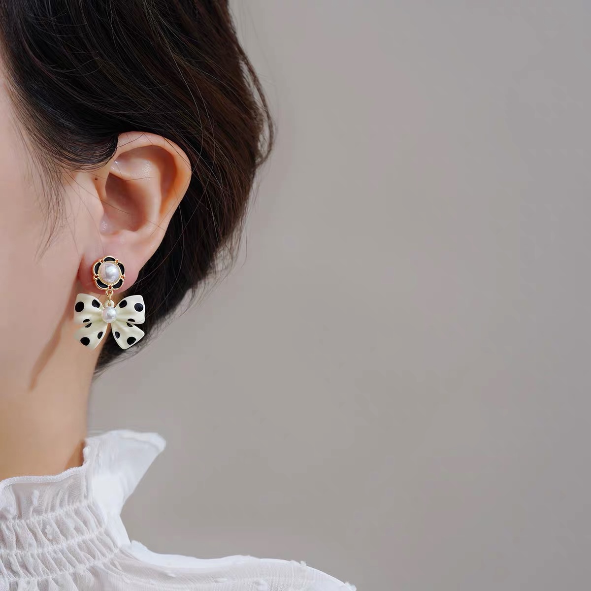 Retro polka dot bow, a unique and gentle design, black butterfly earrings, women's style, Jieya steel jewelry pic 4
