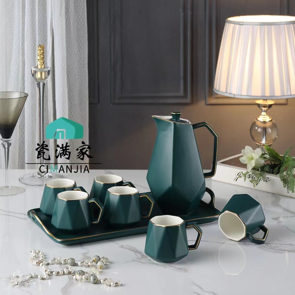 A Pot Of Six Cups And A Plate