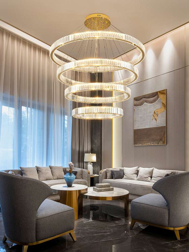 The large chandelier in the living room of a mezzanine building is modern and simple. It is a multi-story staircase lighting fixture and a crystal chandelier in gold for a duplex villa details Picture