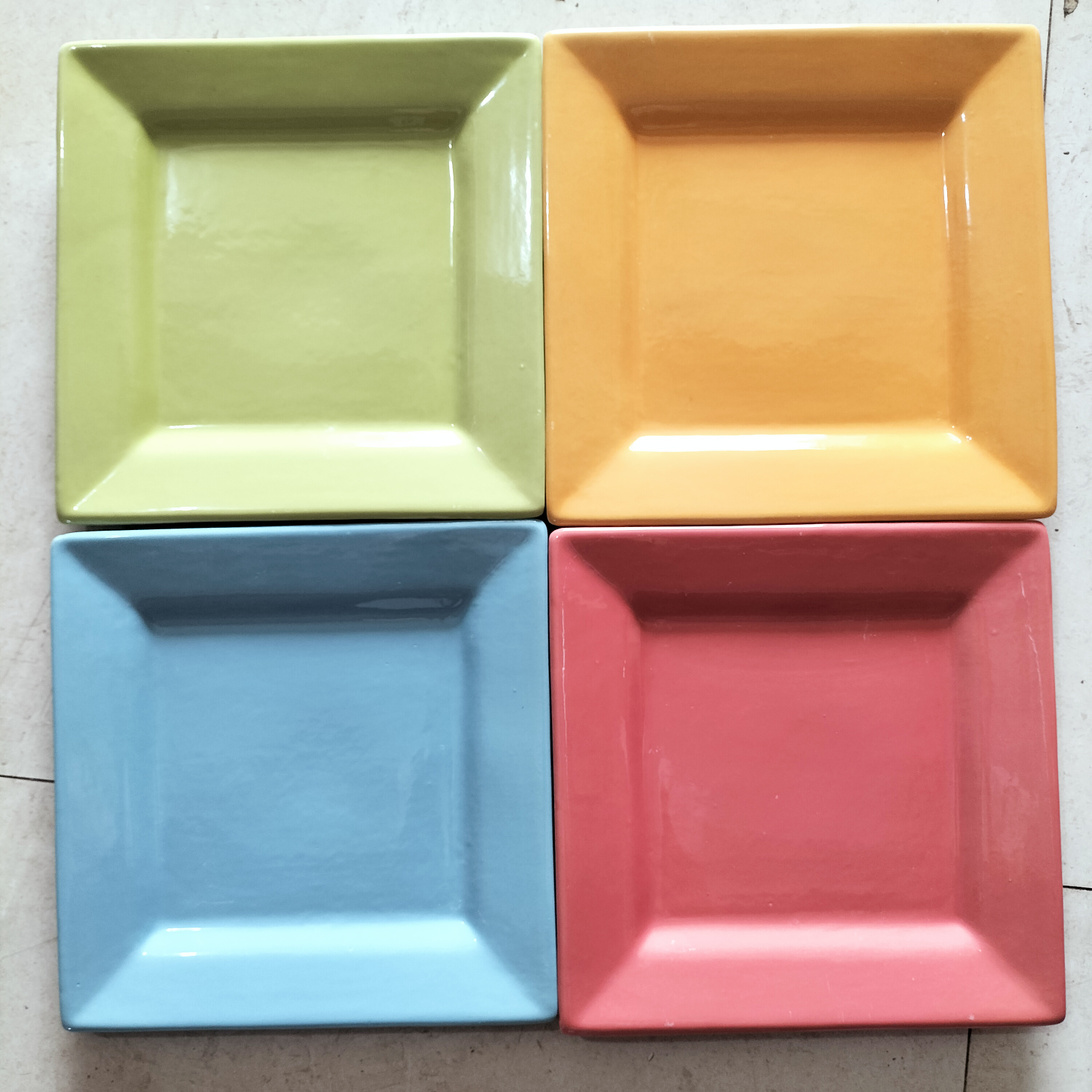 A 10.5-inch square glazed plate