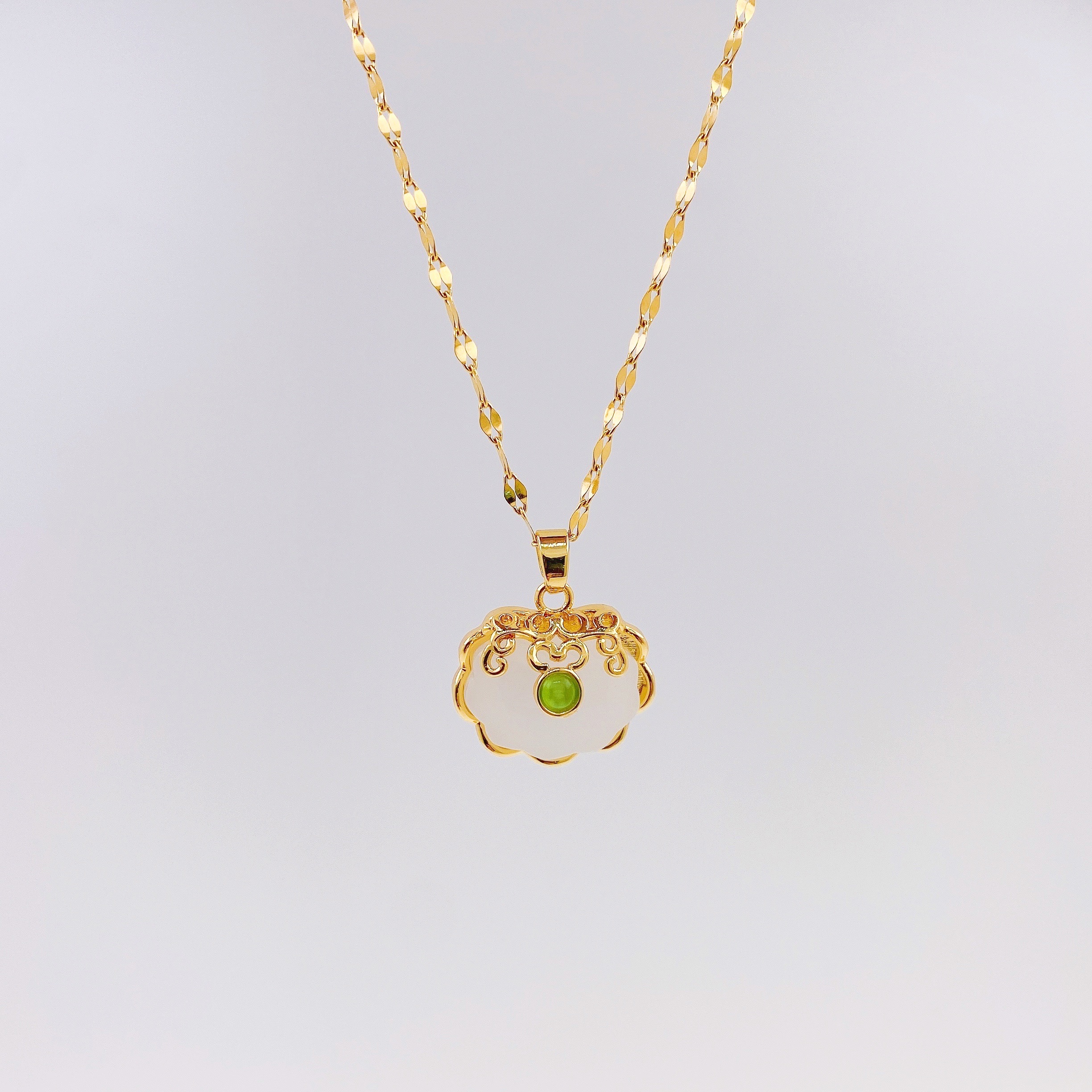 Titanium steel 18K gold imitation Hetian jade peace lock pendant resin necklace, women's gold inlaid jade longevity lock pendant collarbone chain (single pendant without chain) Item Picture