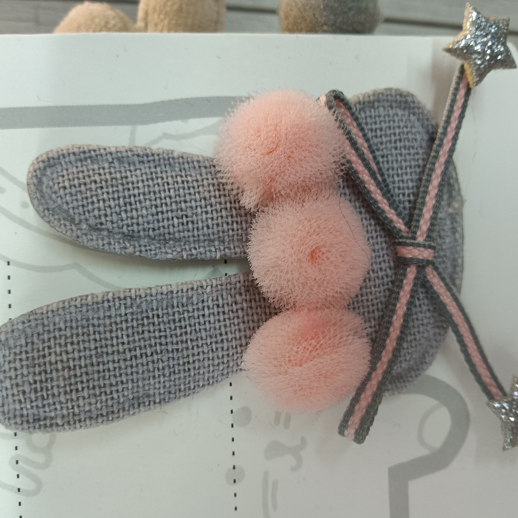 Rabbit head with knot, three balls, star