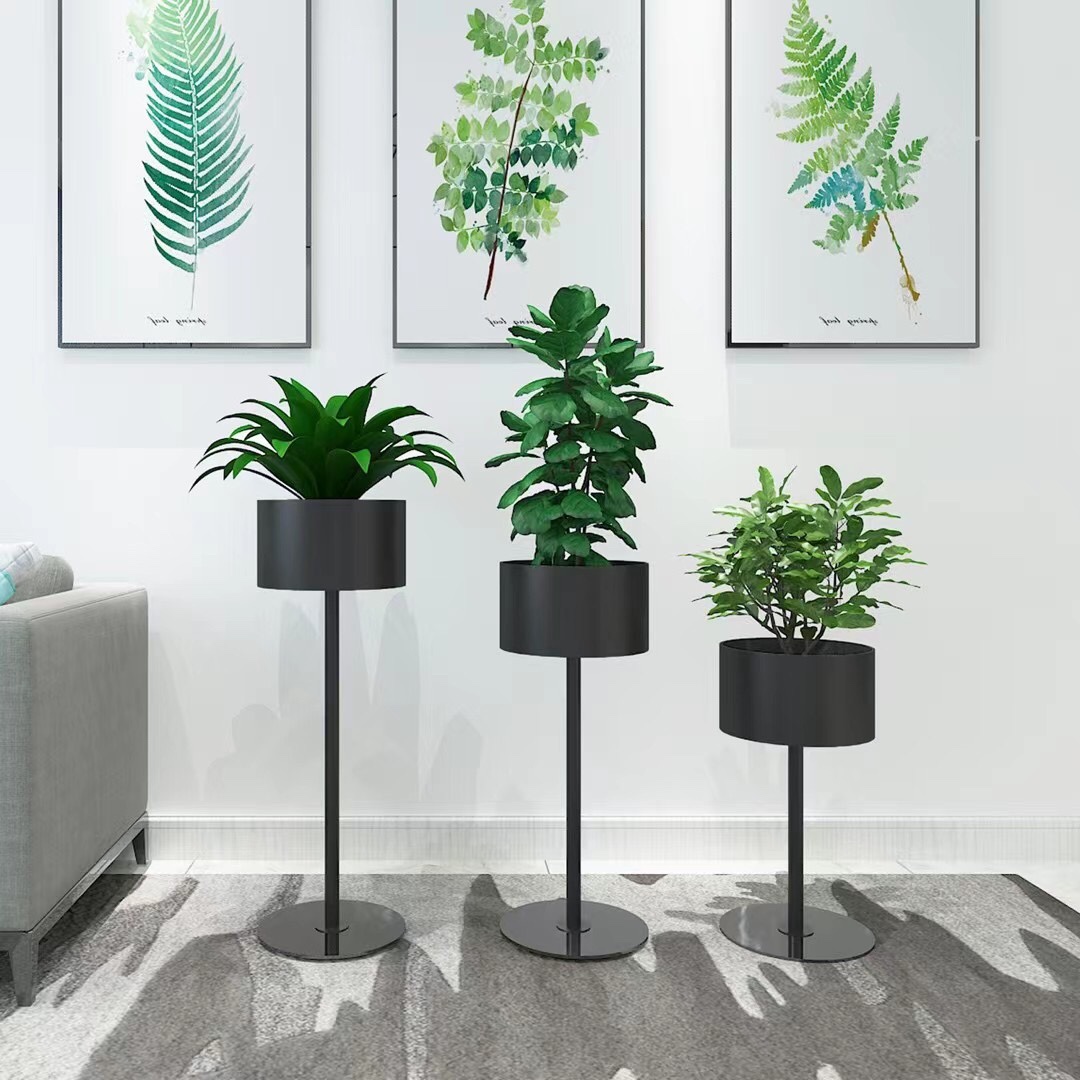 A Nordic-style flower stand beside the TV cabinet in the living room, a single floor-standing light luxury display item, and a green plant stand indoors