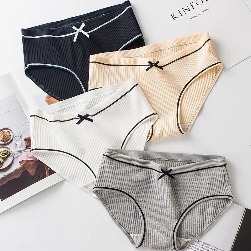 Soft cotton low-rise triangle underwear flat lay