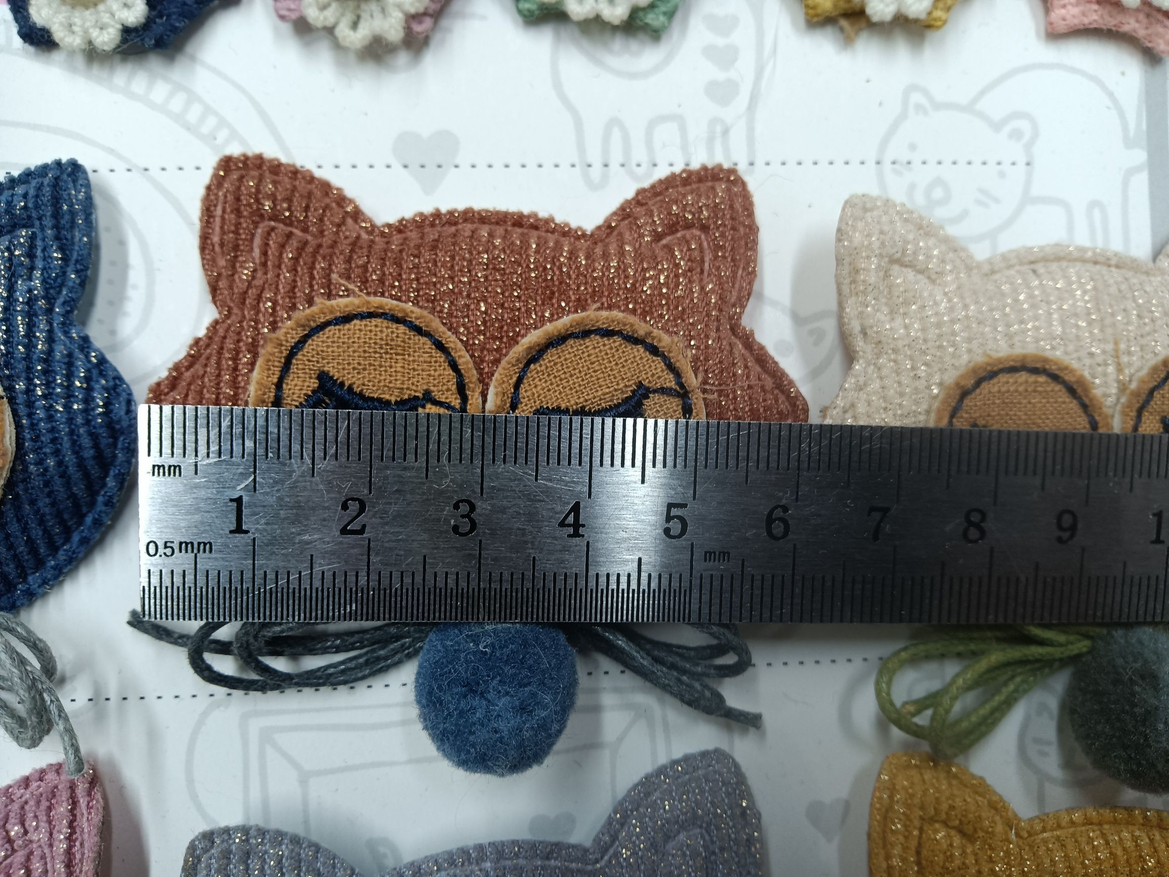 A cat's head hung with beads