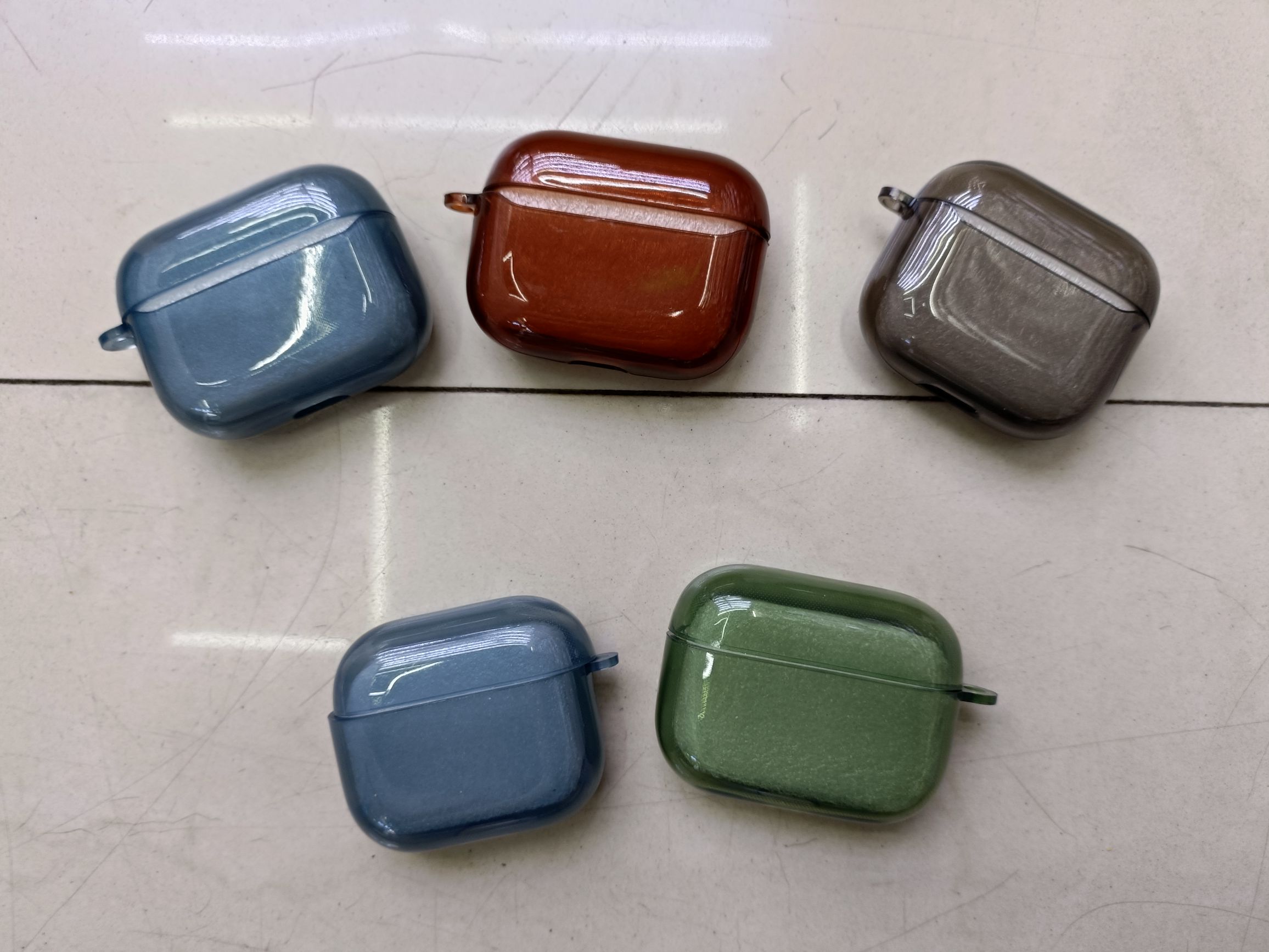 Apple Bluetooth headset case
Black through blue through green material shell with ears
Apple II, Pro, 3