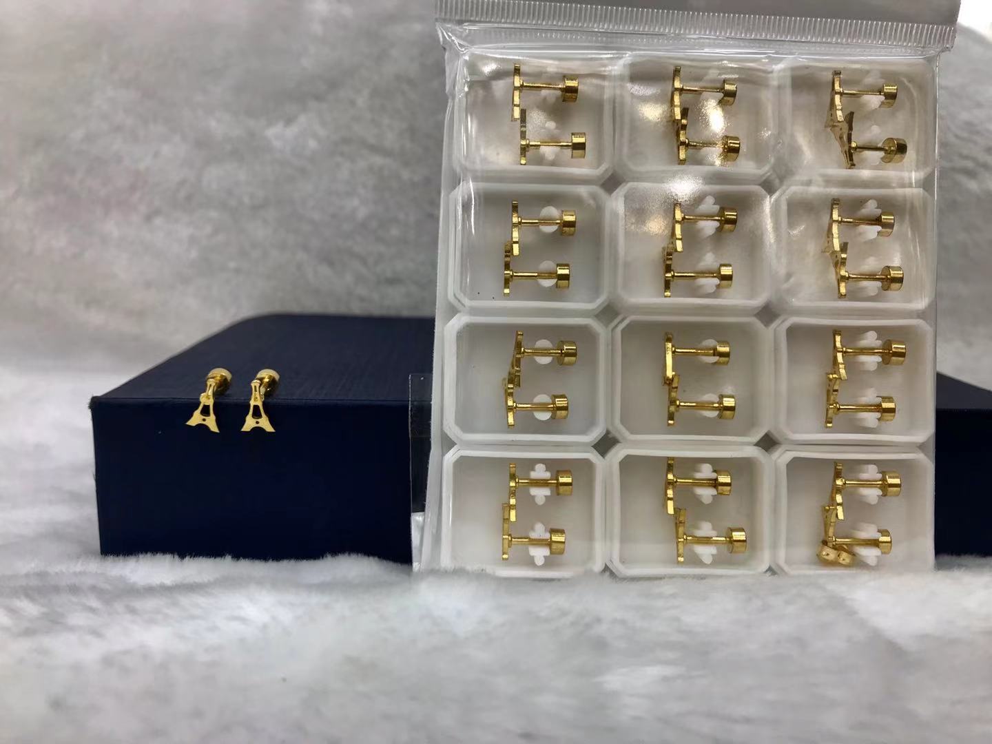 Titanium steel gold hollow pyramid earrings
