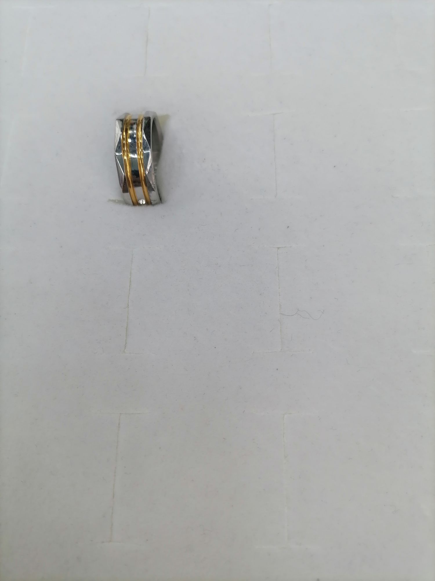 Titanium steel with gold outside a diamond design with 5 diamond rings
