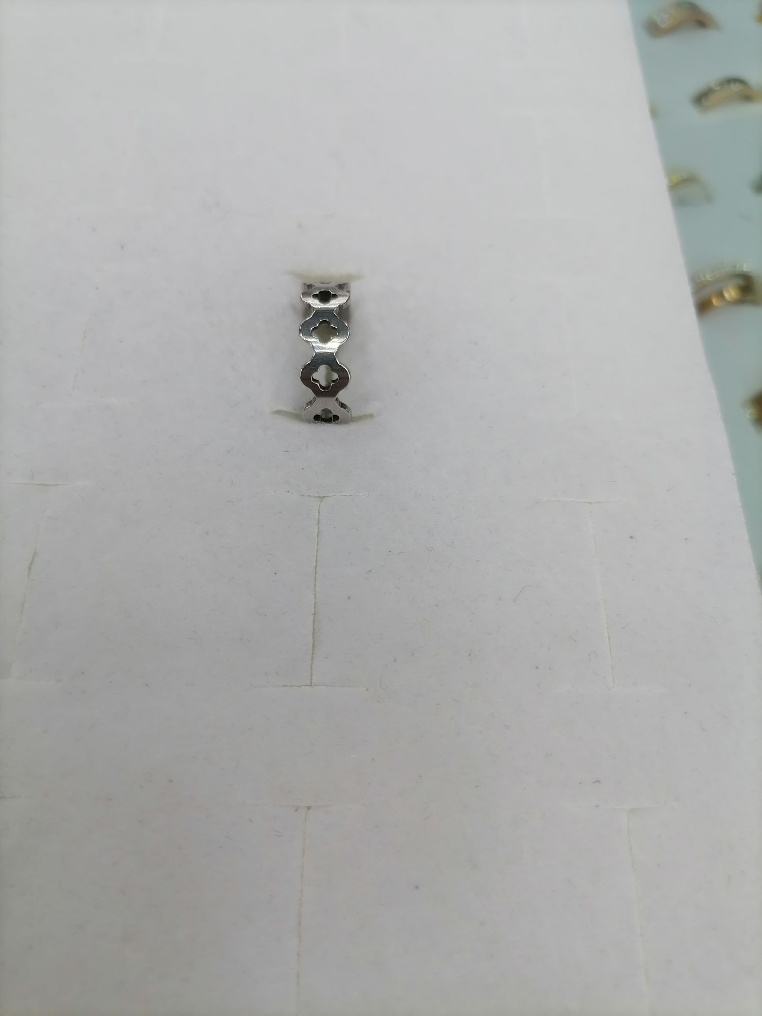 Titanium steel silver half-hollowed four-leaf clover ring