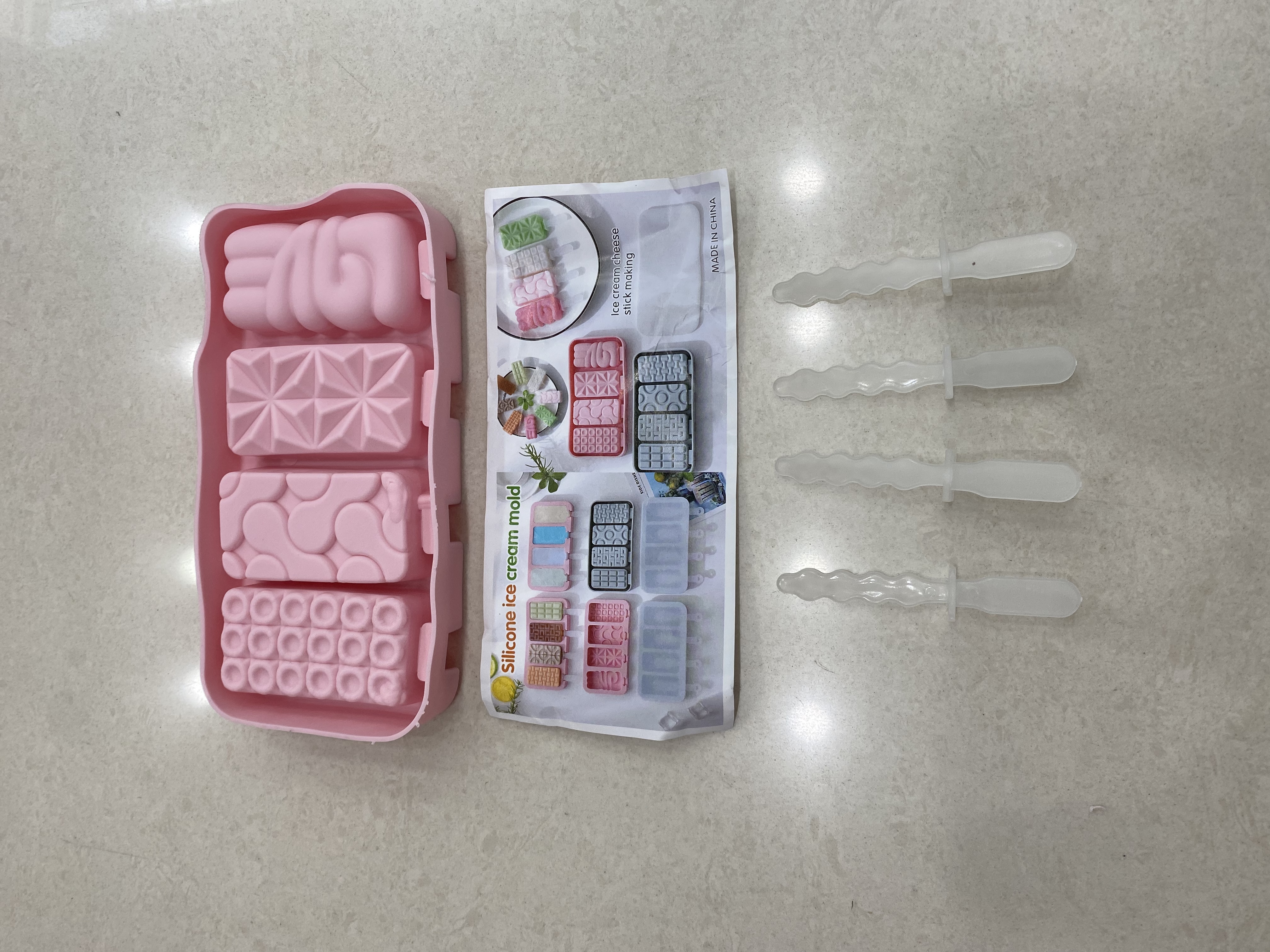 Four ice cream molds in a row
