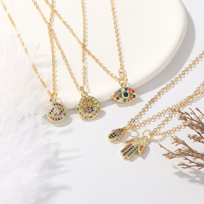Stylish copper plated gold micro-inset zircon geometric palm eye pendant