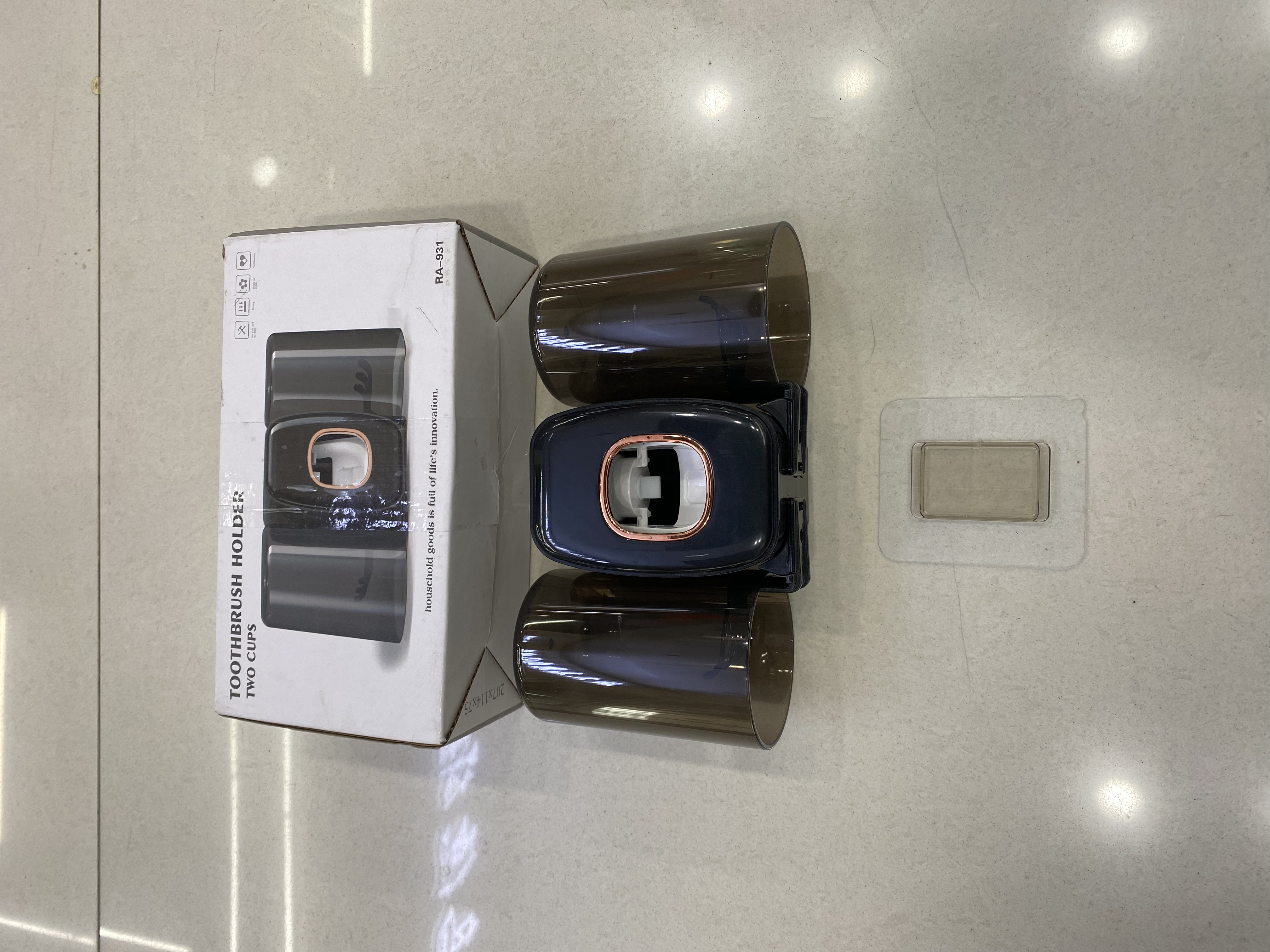 Toothbrush holder squeezer