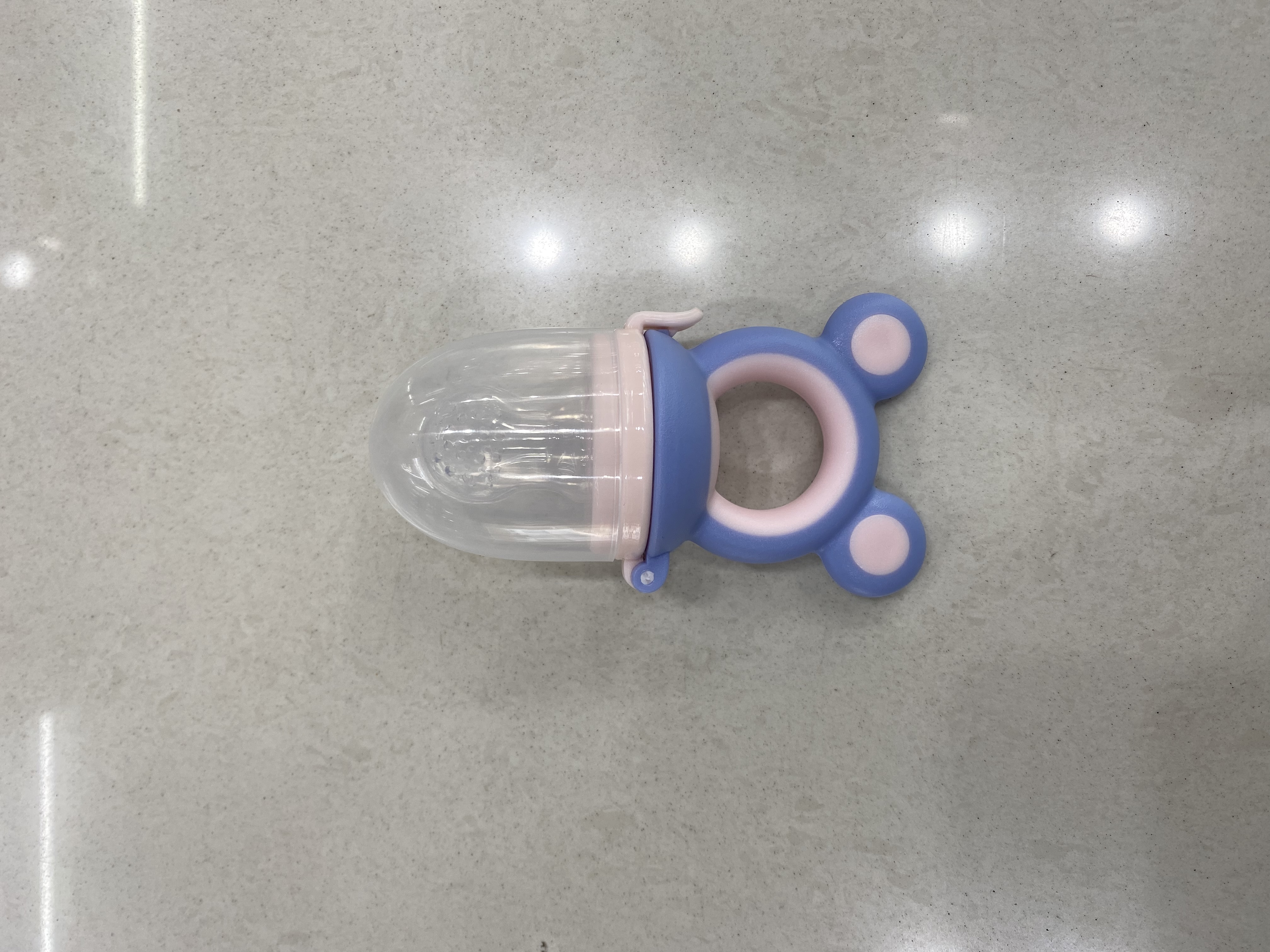 The frog bites the happy pacifier