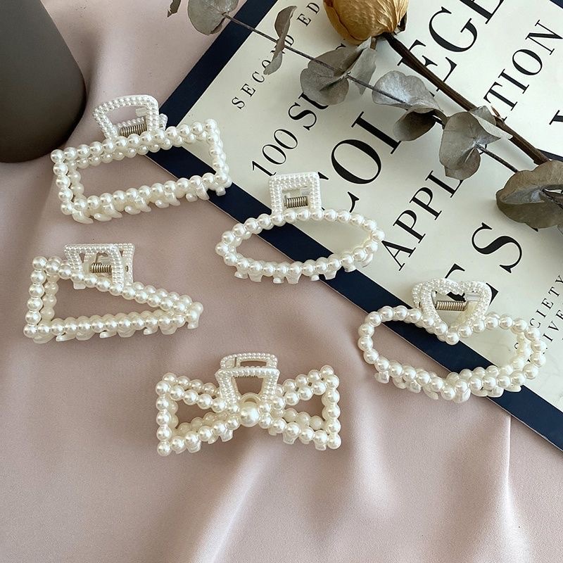 Yiwu International Trade City again good accessories 3569 booth headgear wholesale net red large pearl grab clip love bath shark clip temperament hairpin back head headgear gift stall wholesale thumbnail