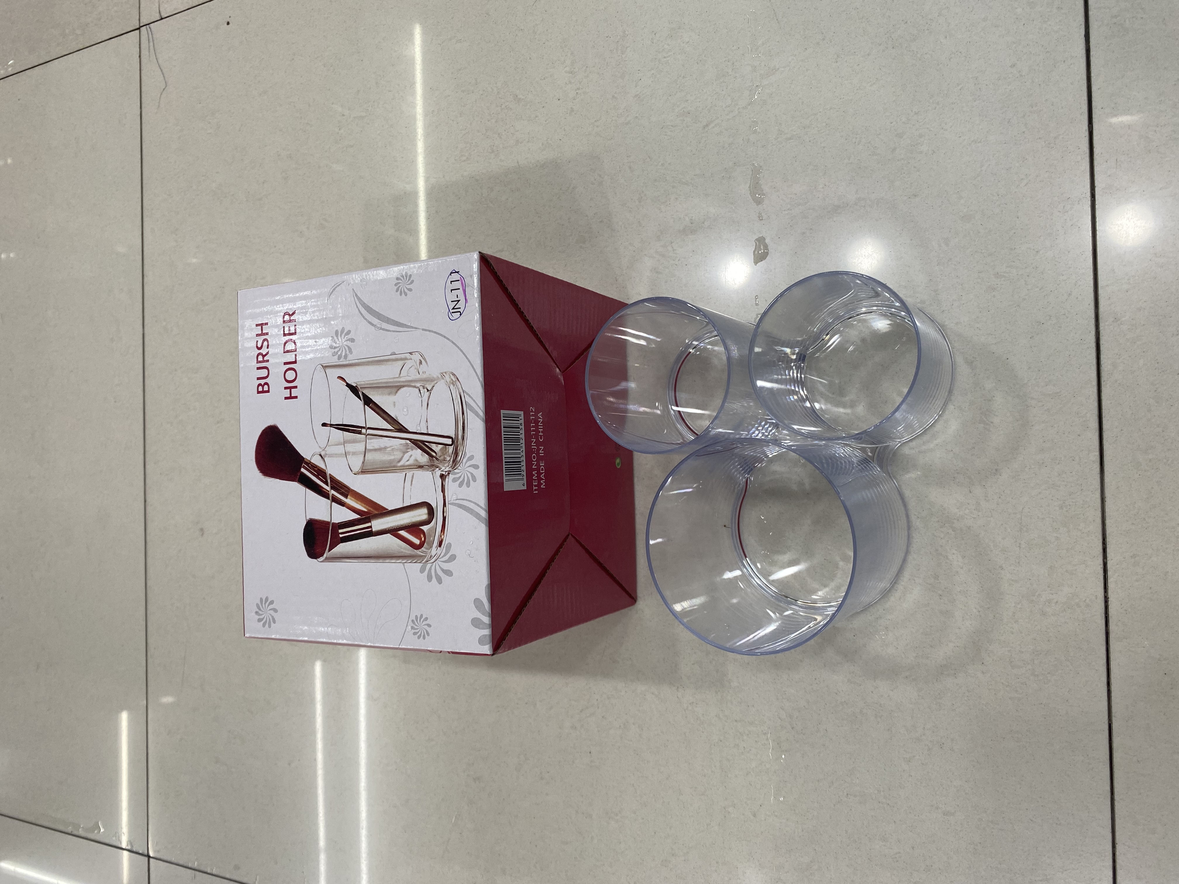 Three-cup makeup rack