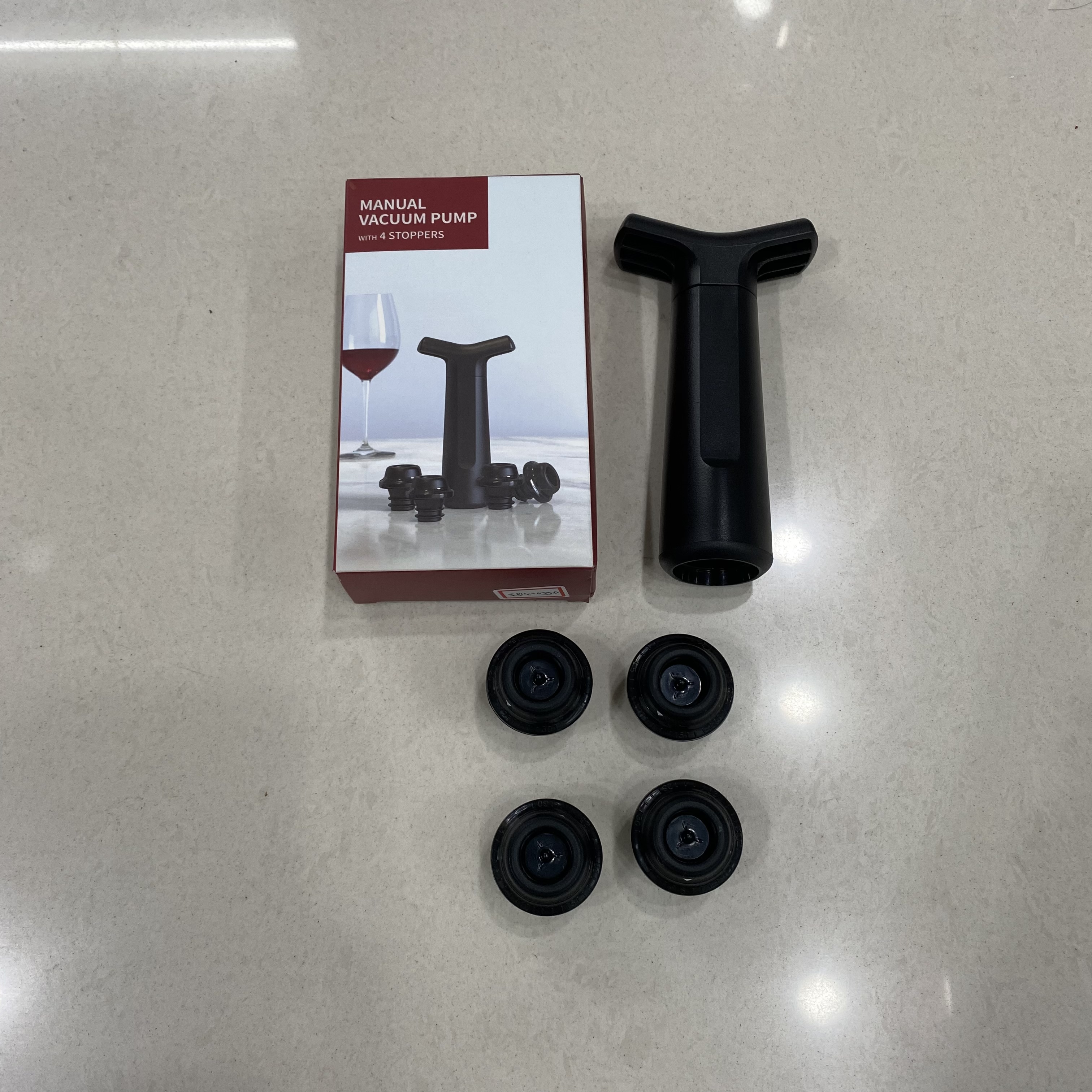 Four wine stoppers to a pump