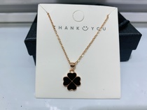 The classic four-leaf clover necklace can be worn on both sides