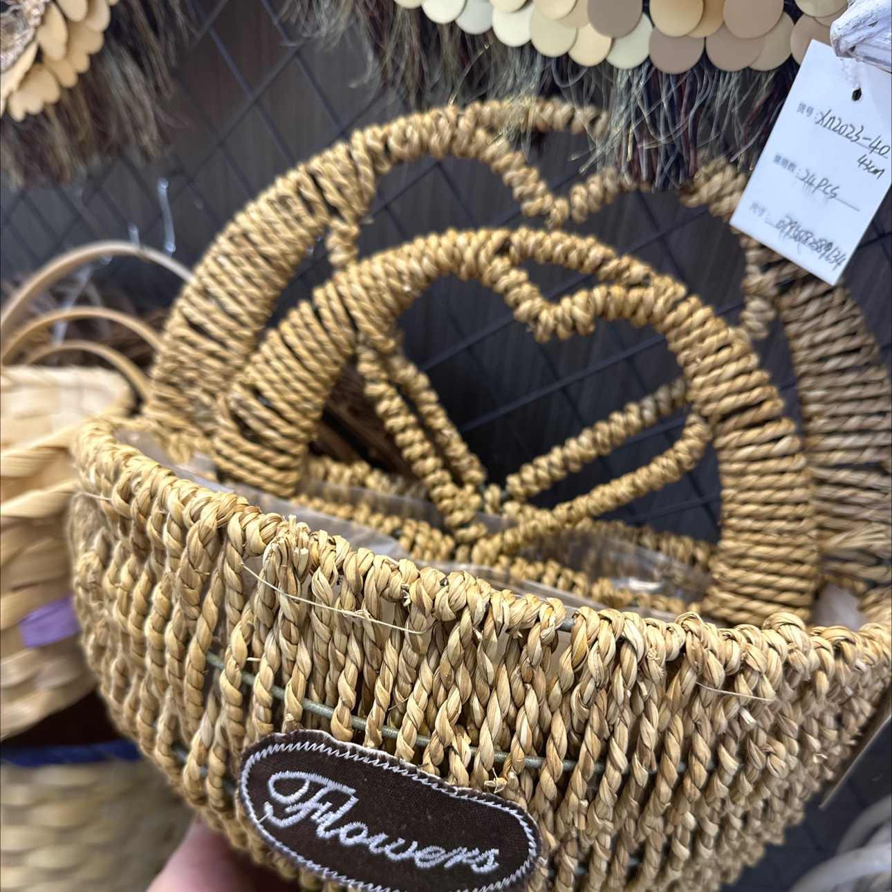 Two wall hangers made of horticultural woven straw