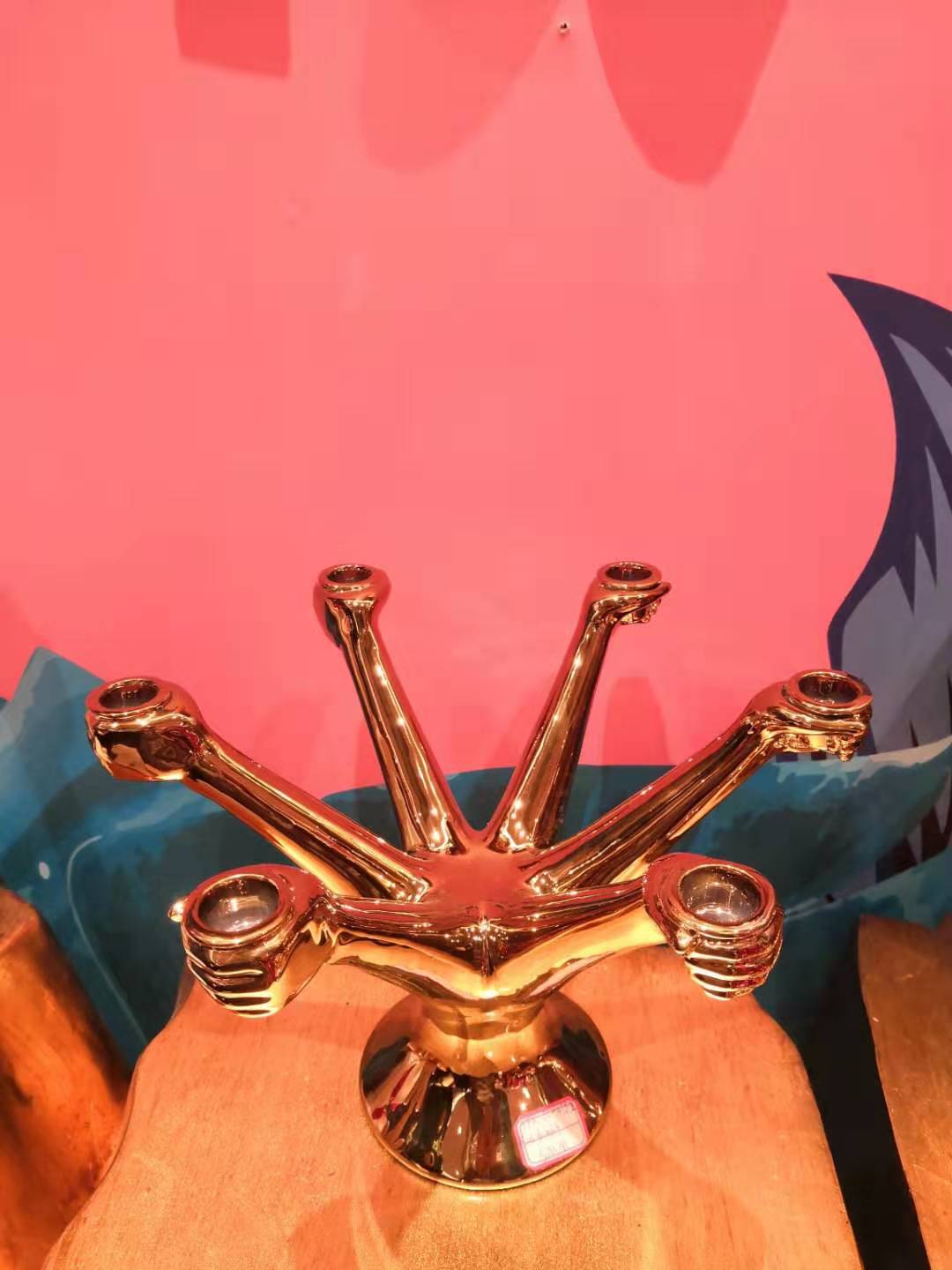 The ceramic gold candlestick is 23.6*34 cm tall. It is a creative torchbearer. The ceramic candlestick is a light luxury American retro model room. It is a designer's gold INS candle stand Application Scenario