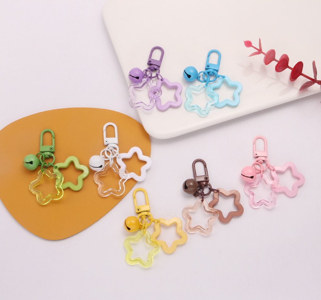 New color acrylic hollowed-out five-pointed star keychain headphone case decoration