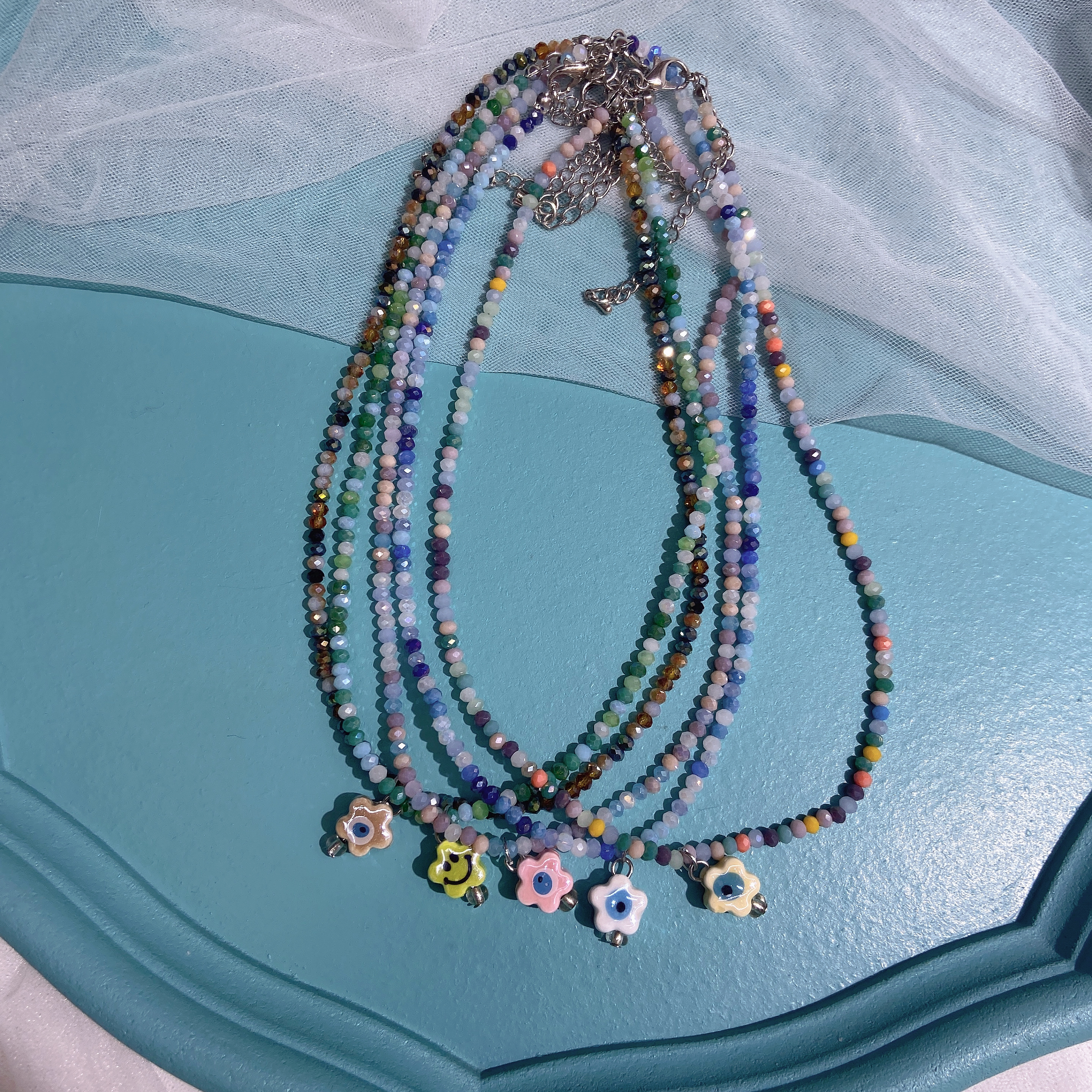 Hand-woven rice bead necklace with smiling face ceramic