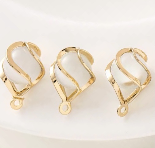 diy accessory, handcrafted bracelet, necklace and decorative pendant with a dynamic cat's eye stone bead around the cage