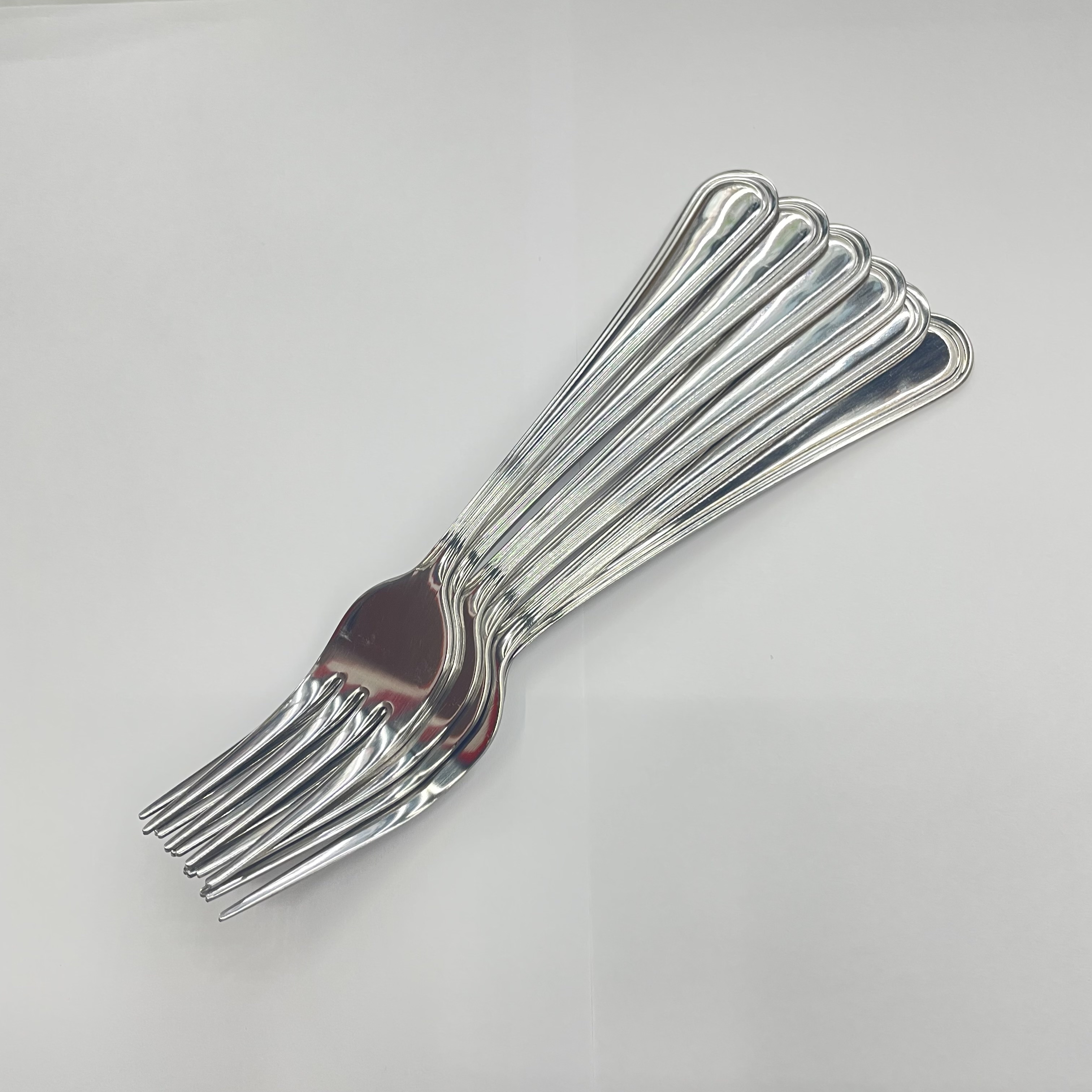 Close-up of hand holding the premium spoon and knife