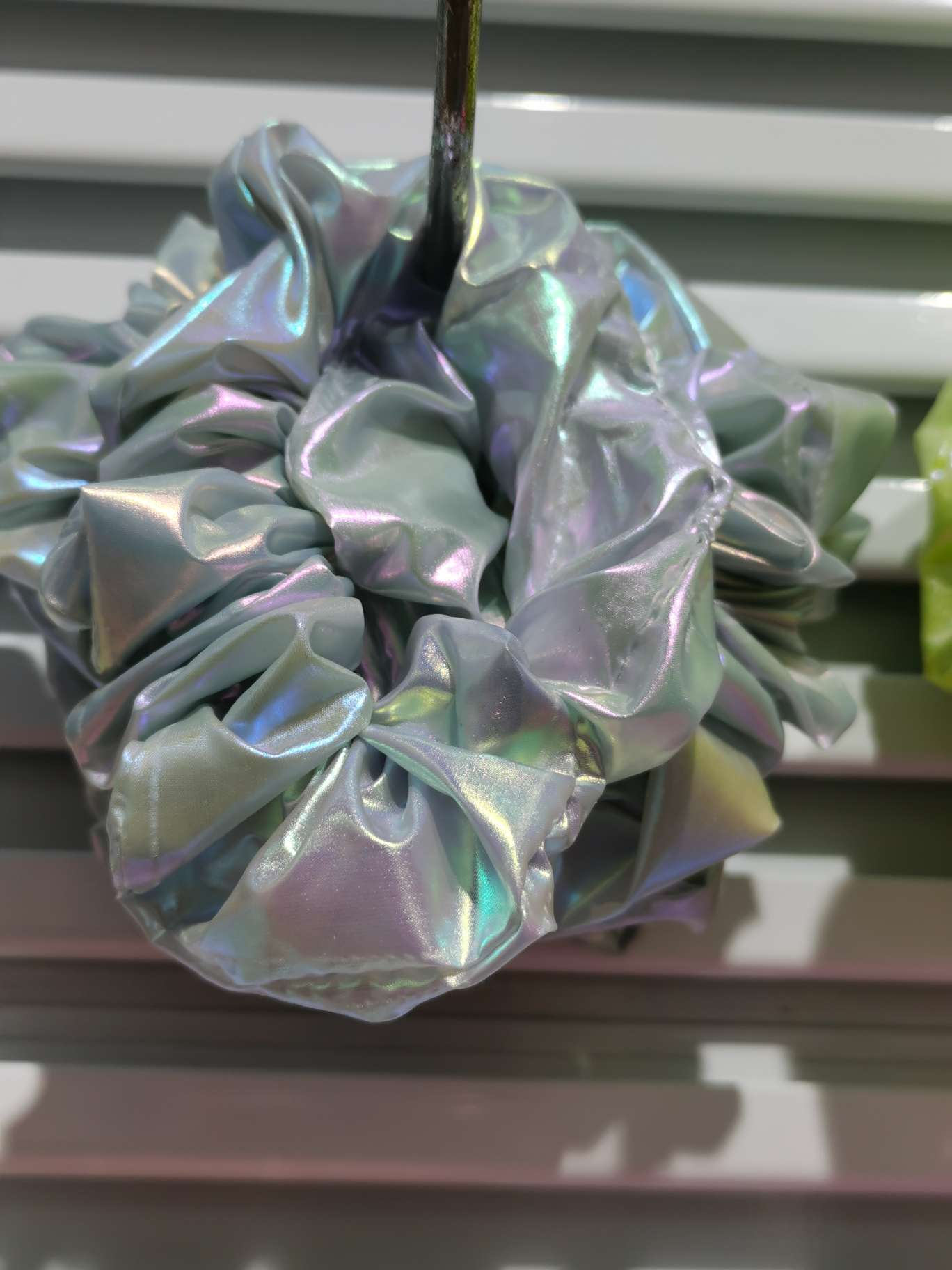 Scrunchie used as a decorative handle wrap on a tote bag