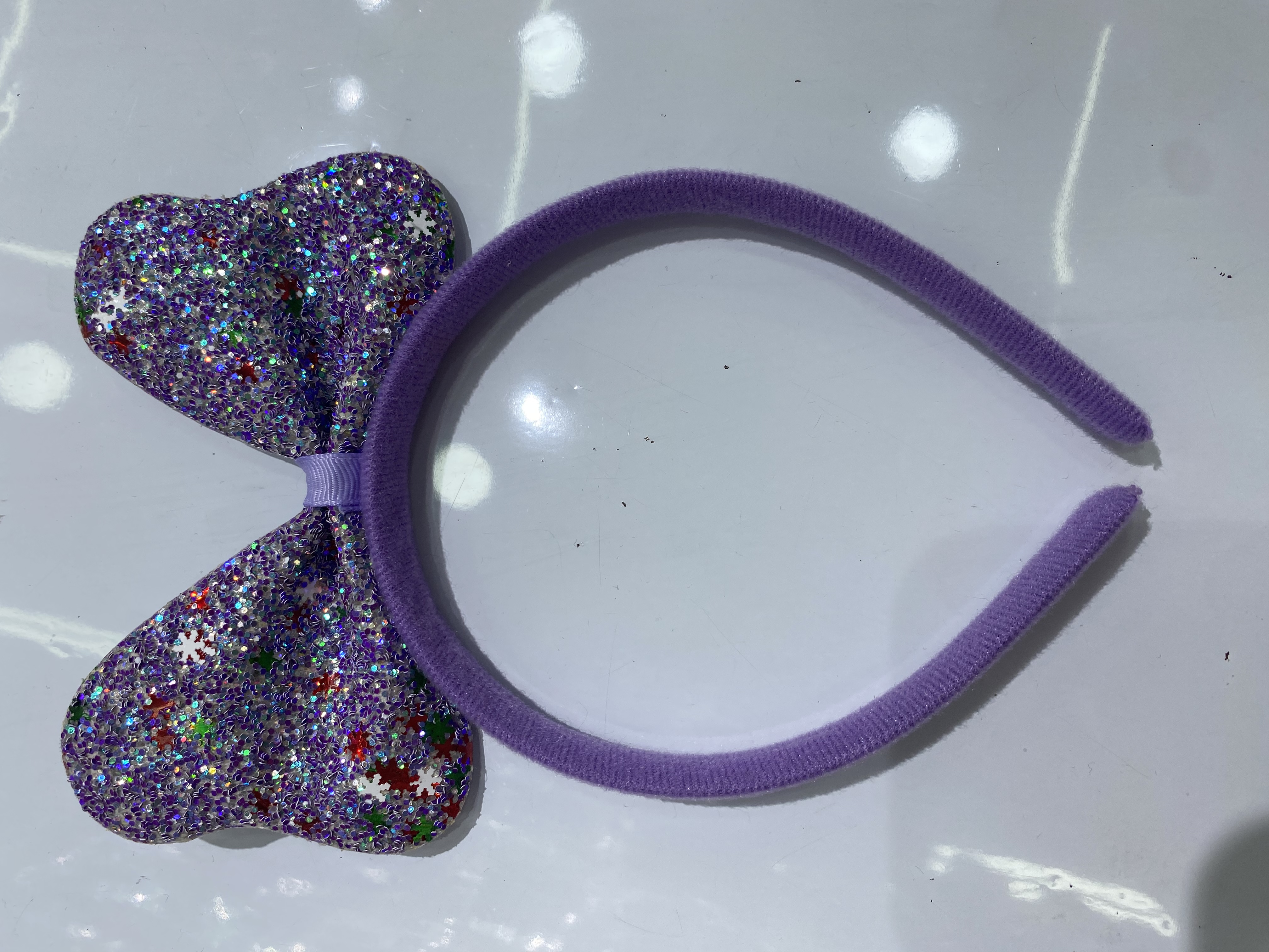 A best-selling headband with a thick powder and a snowflake round head bow Specification image
