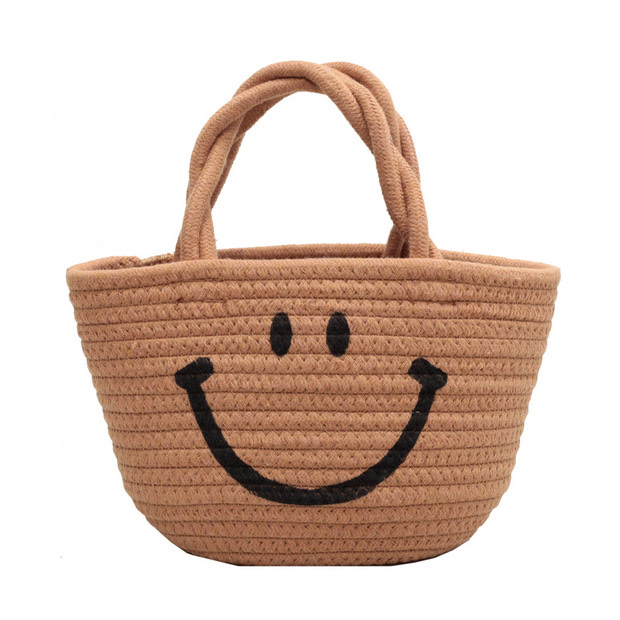 Wholesale of new hand-woven bags, emoticons, smiling straw woven bags and beach hand-held bucket bags Item Picture