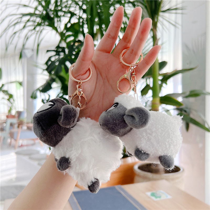 Sheep got a little goat pendant a little plush doll doll bag hanging a couple key chain A car key chain