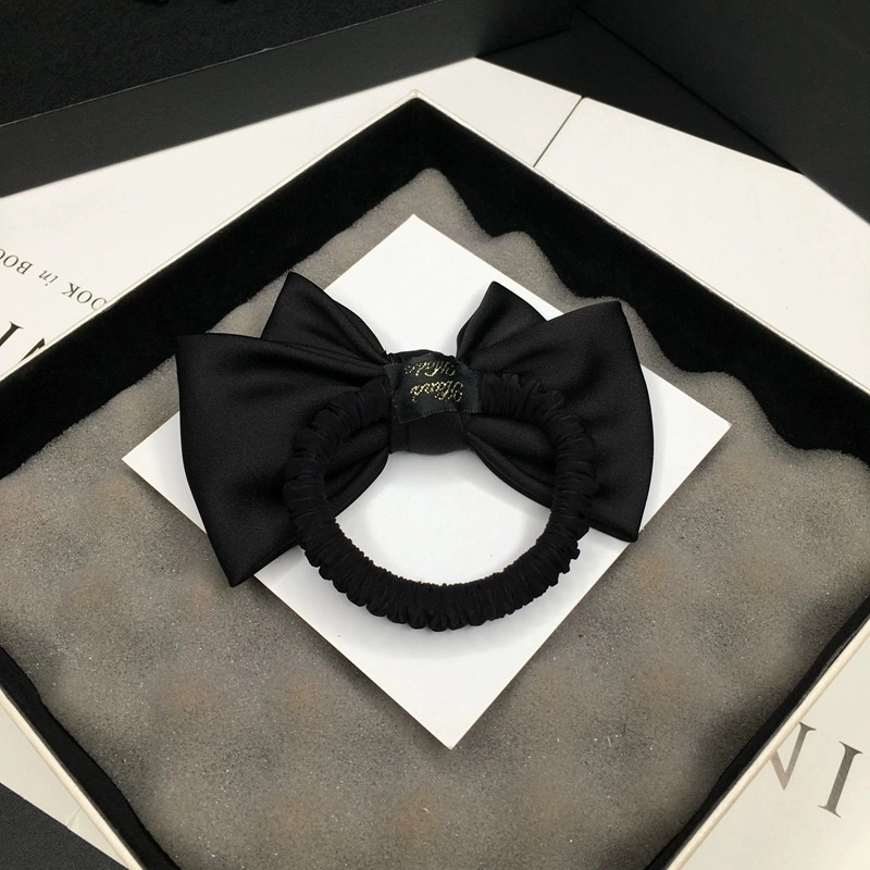 The exquisite medium-sized bow tie is simple and elegant. The black hair tie is versatile for daily use. The satin fabric headwear and hair flower are perfect for women detail image 2