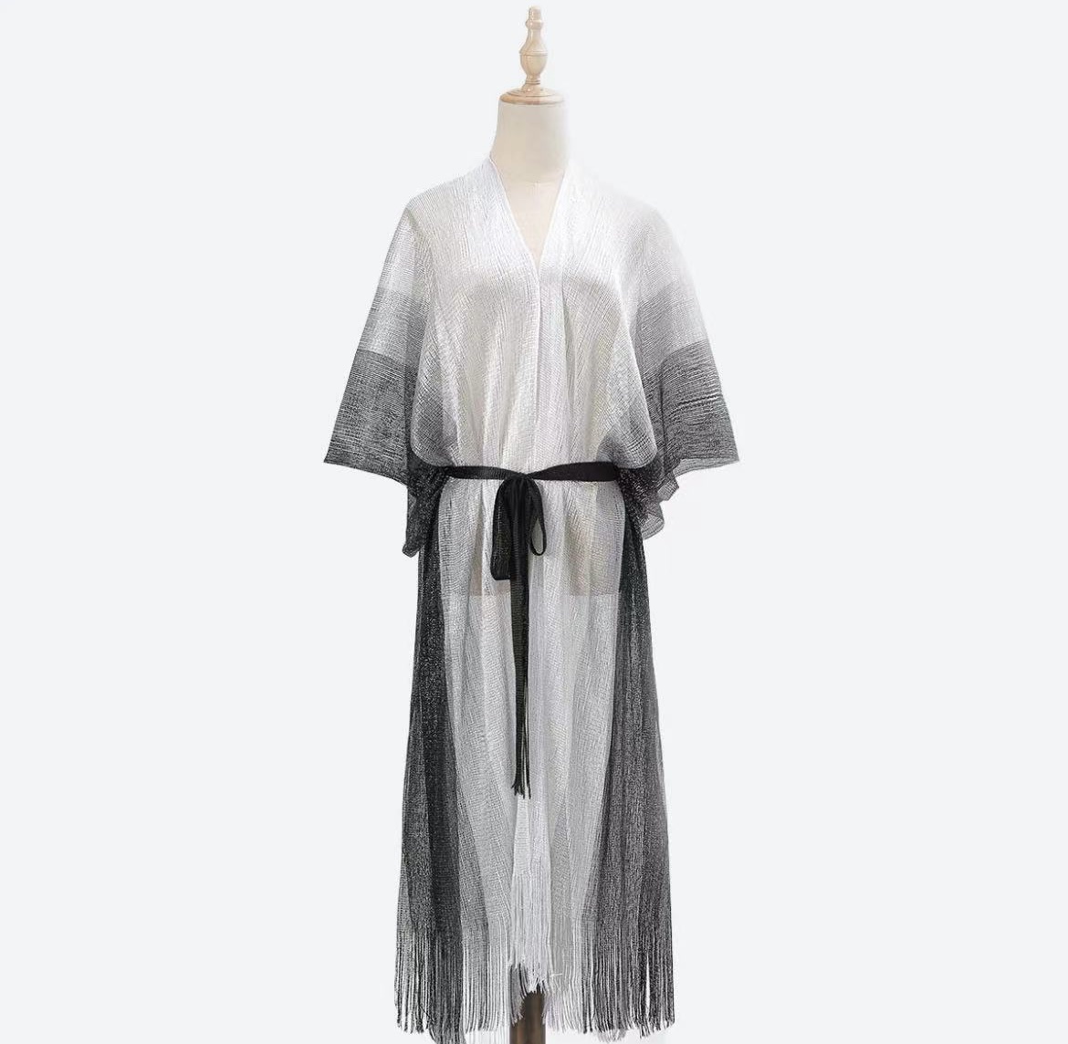 Cross Border Pop Filigree Striped Polyester Knitted Shawl Belt Thin Sunblock Shawl Tassel Beach Shawl Application Scenario