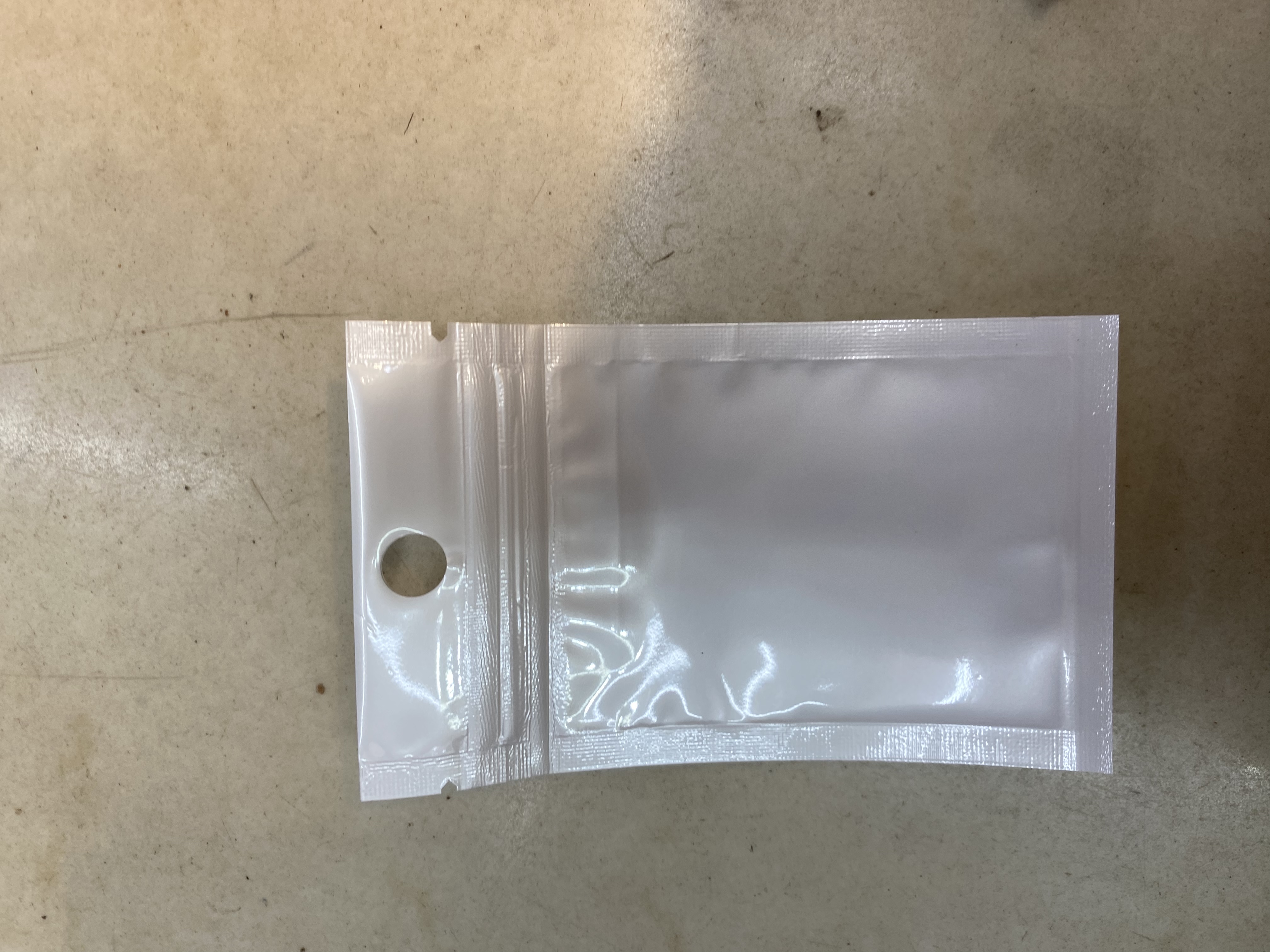 白色珠光膜阴阳自封袋子半透明耳机挂孔饰品拉骨袋密封塑料包装袋产品图