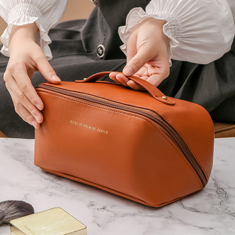 PU organ pillow makeup bag, women's hand-held large-capacity travel portable, ins high-end style toiletry and makeup storage bag Application Scenario