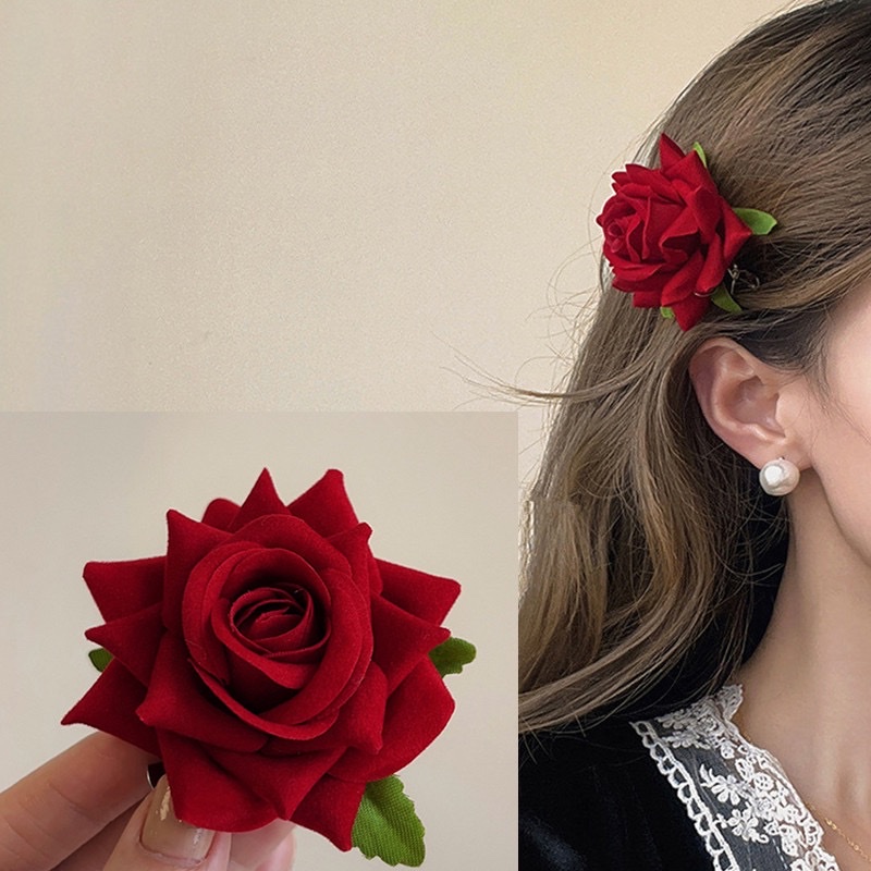 The 2023 new Dew Rose French retro red artificial flower hairpin features a fairy-like and niche design with bangs