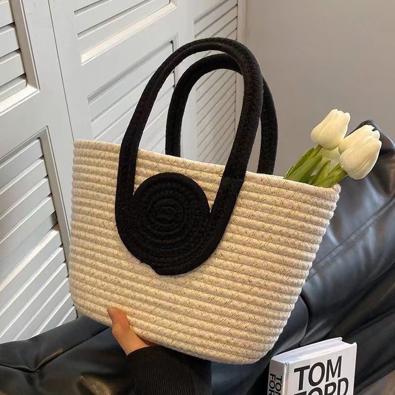 The new internet-famous best-selling handbag features a niche design, fashionable woven bag, versatile and simple handbag, small basket storage, woven bag, women's straw weaving artistic bag, women's straw weaving artistic women's bag, women's straw weaving popular detail image 4