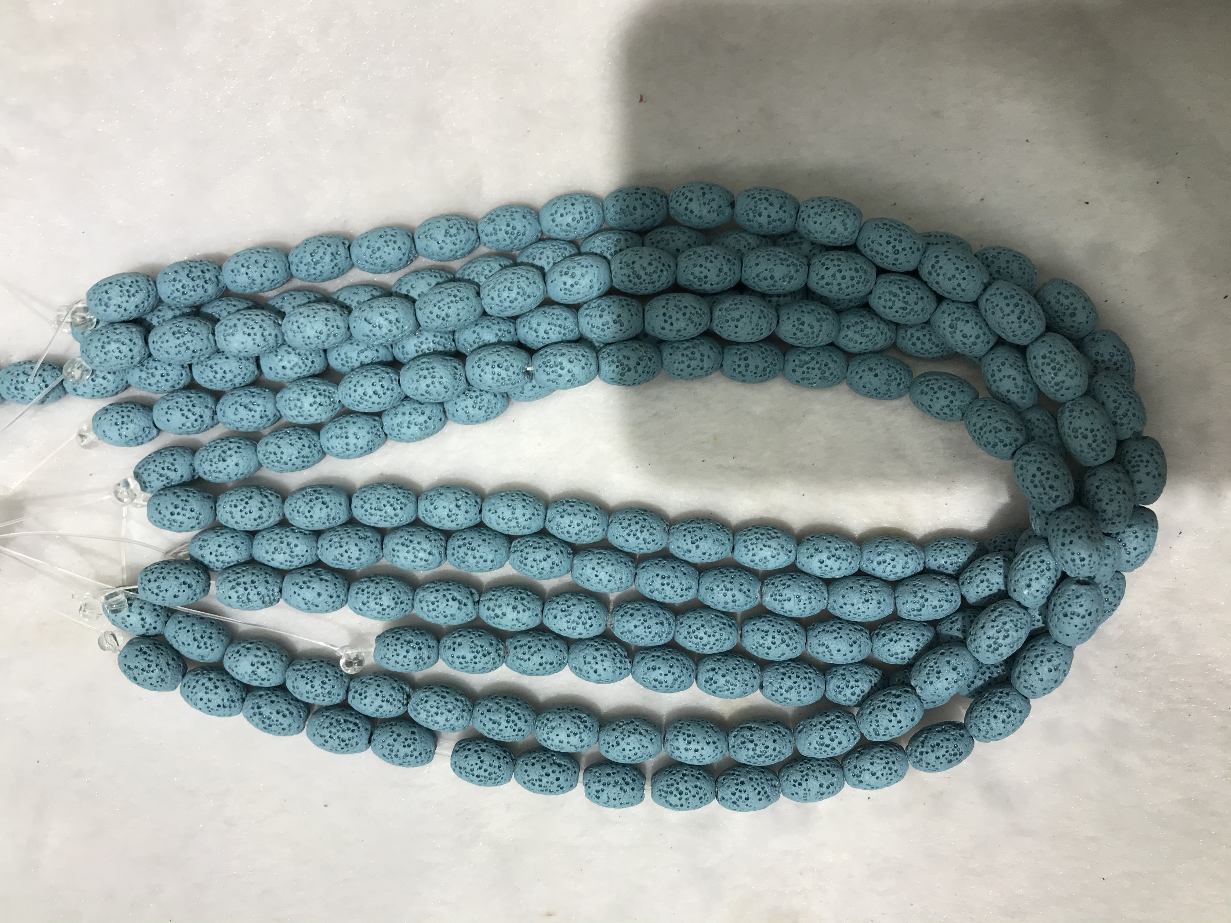 火山石8x12椭圆形浅蓝色、今年新款流行、其中这款有18个颜色、