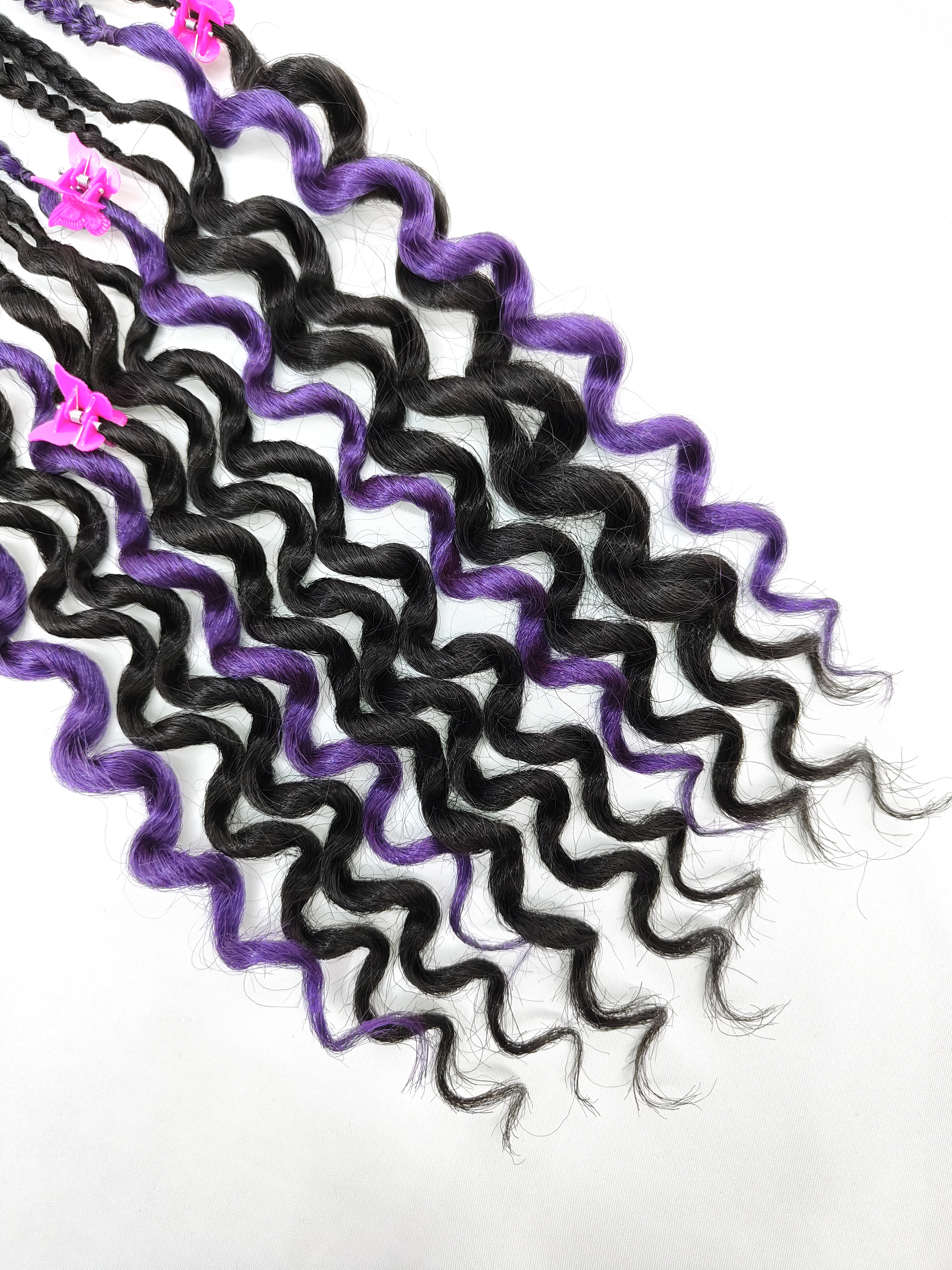 A purple and black synthetic fiber wig for children with a ponytail details Picture