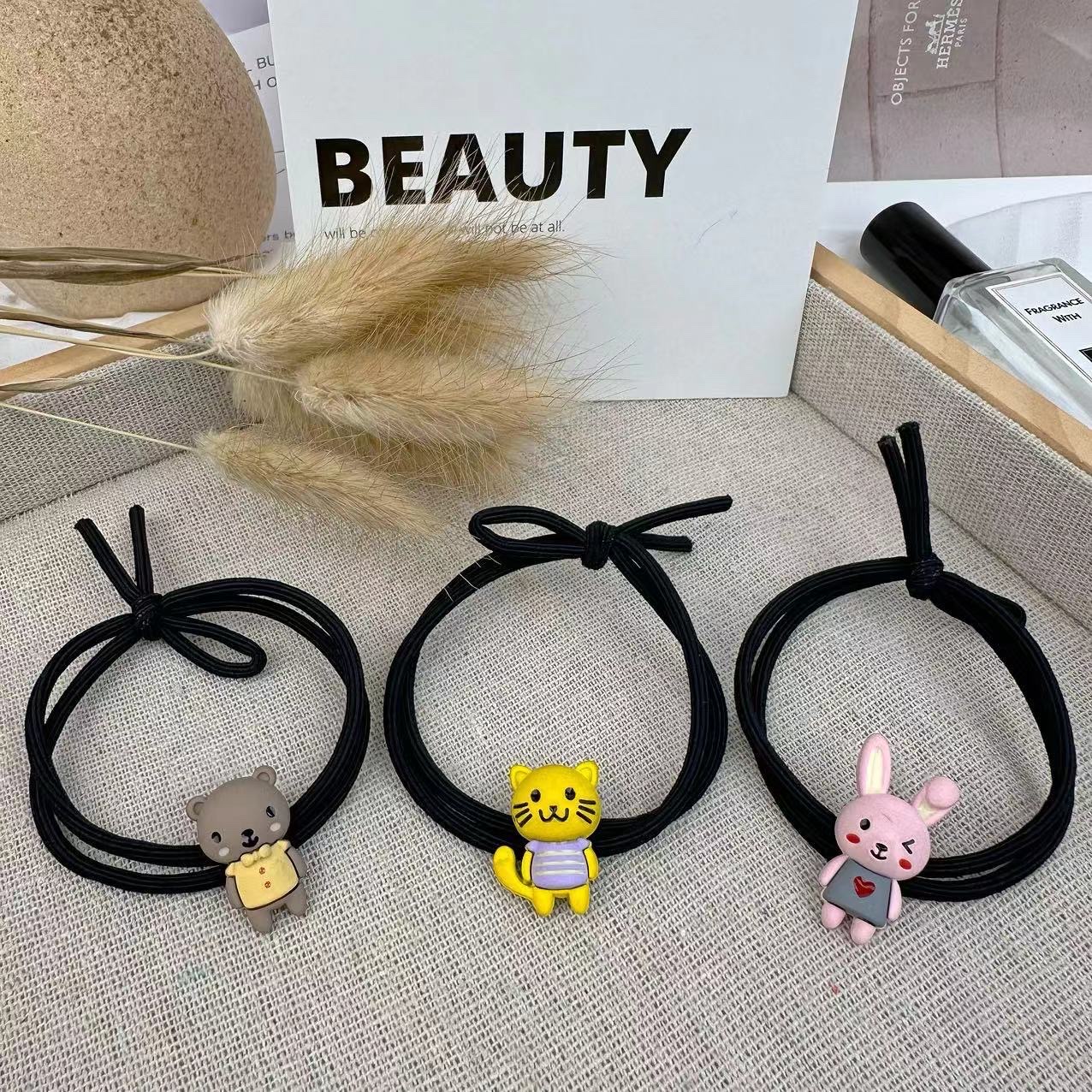 Simple smiling face alloy hair tie for women, Korean style, versatile and elegant hair band, new high-end ponytail leather band hair tie headwear