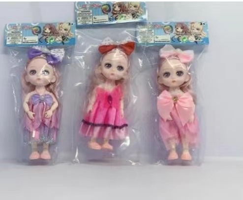 A doll in a card head bag