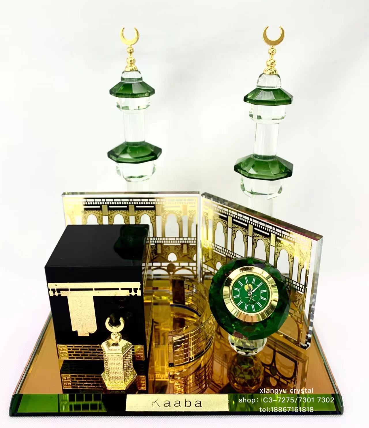 The glass handicraft ornament has a crystal base with a black house, a green clock on top, two crystal pillars with metal rods added to them, and a fence. The style is novel, unique and fashionable