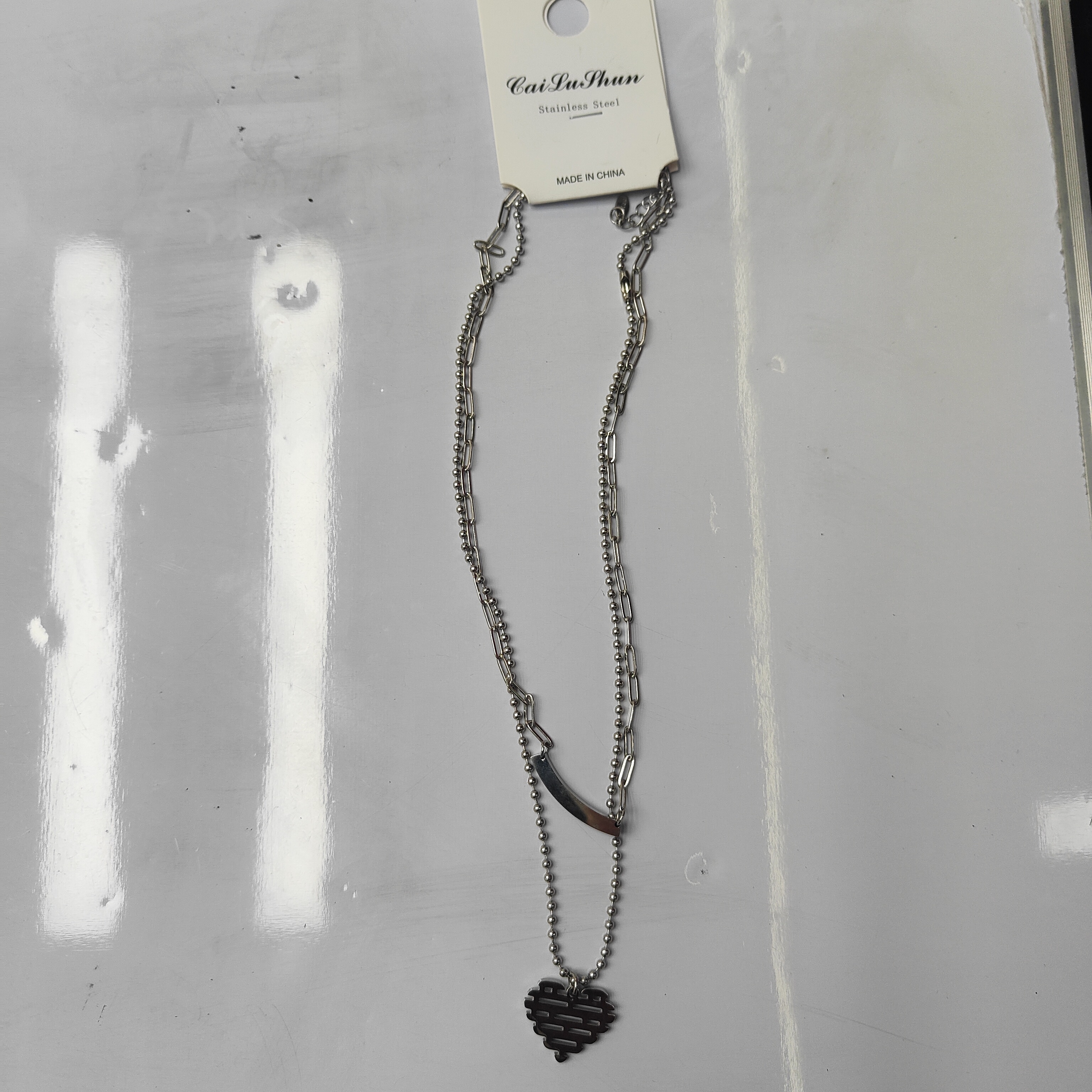 A fashionable stainless steel bestseller, double-layered Mosaic heart-shaped crossbar English necklace, unisex chain for both men and women detail image 4