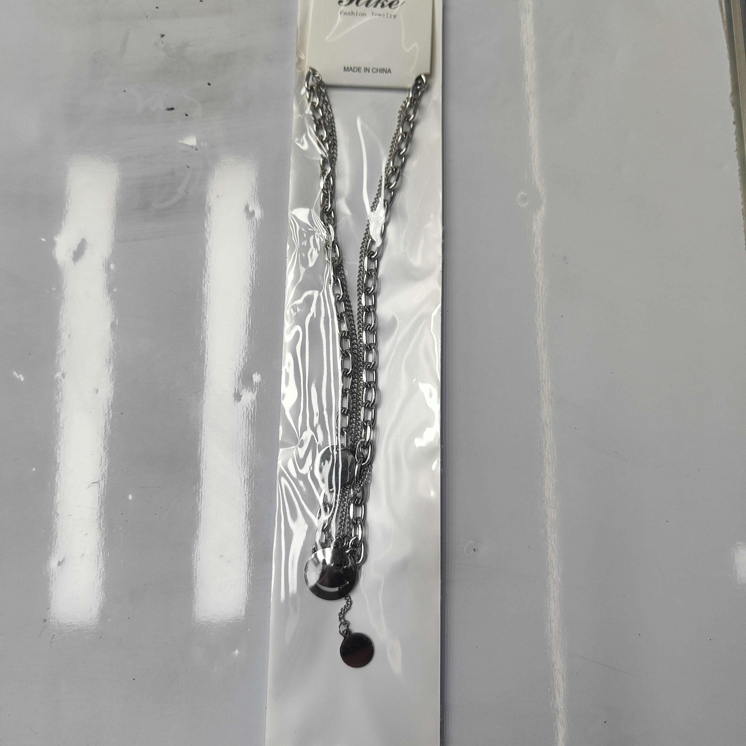 A fashionable stainless steel bestseller, double-layered smiling face necklace, unisex chain suitable for both men and women