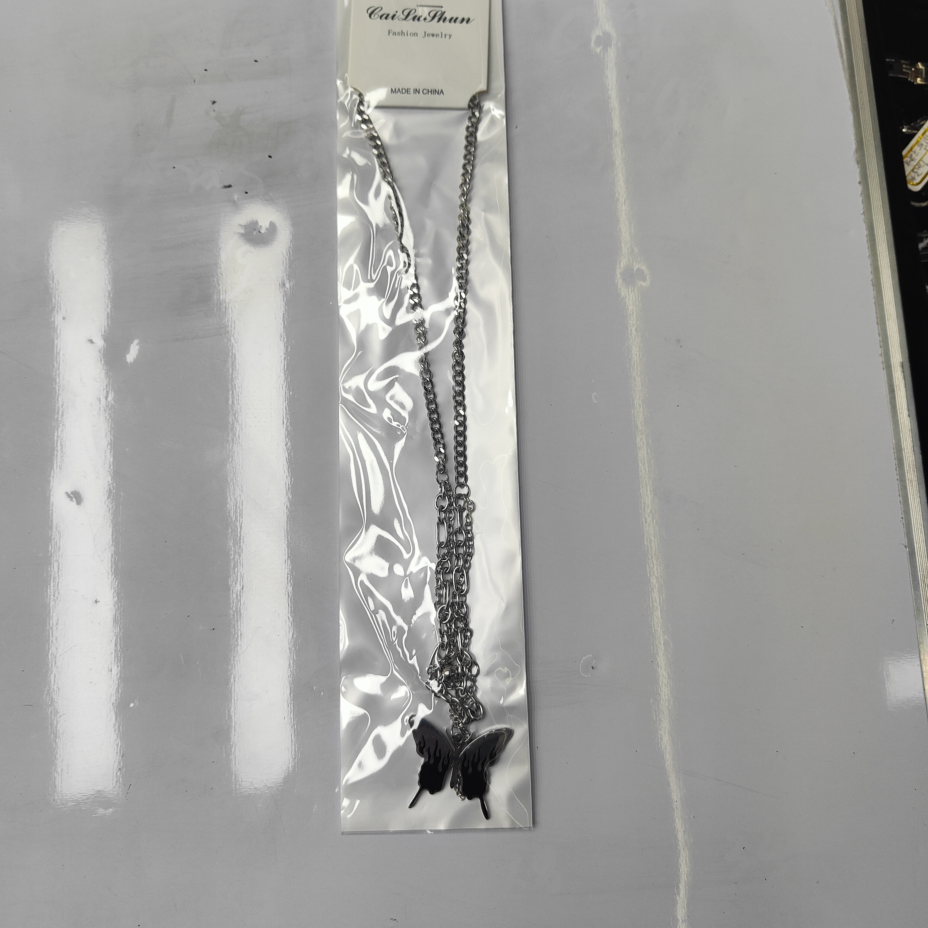 A fashionable stainless steel bestseller, double-layered butterfly necklace, unisex chain tassel accessory for both men and women