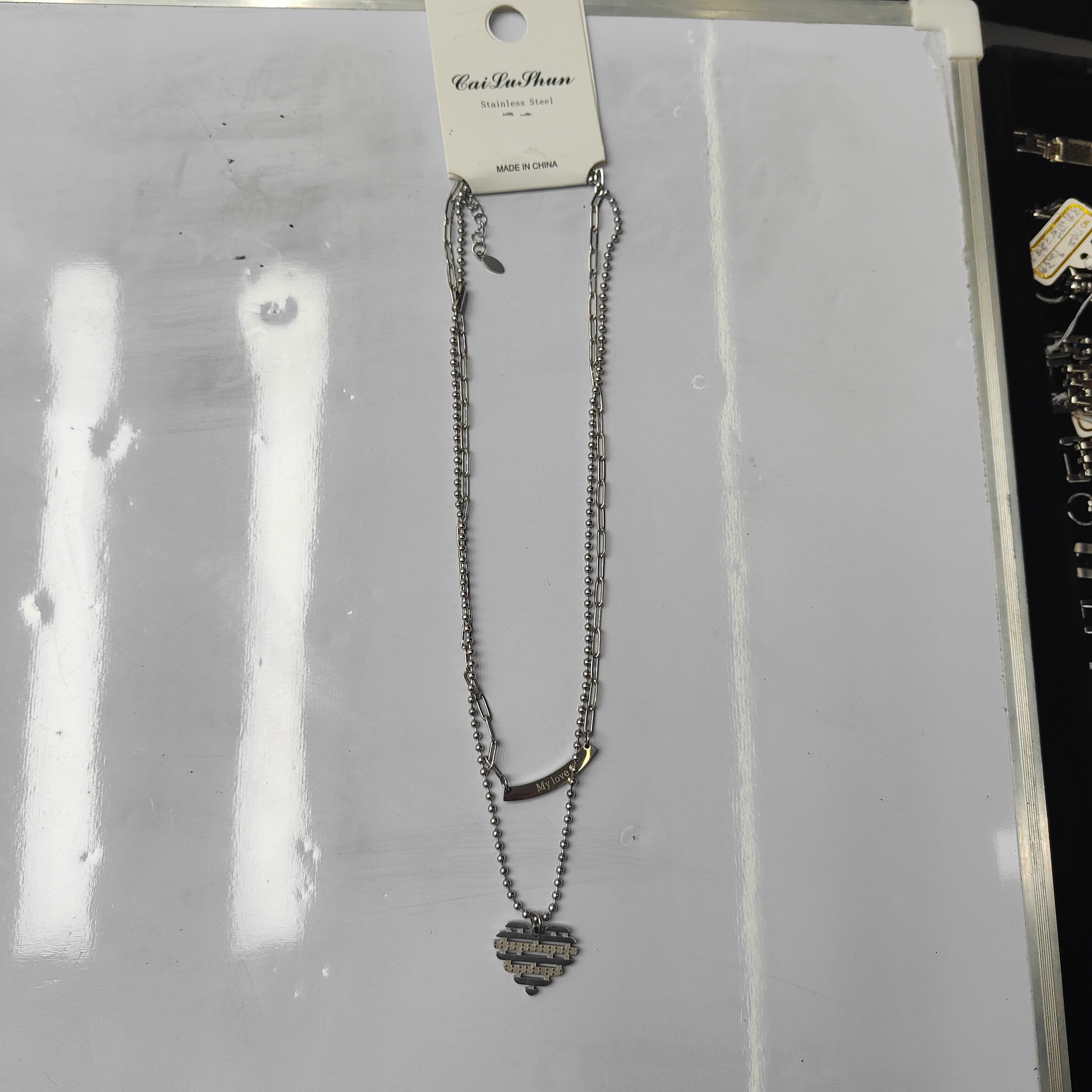 A fashionable stainless steel bestseller, double-layered Mosaic heart-shaped crossbar English necklace, unisex chain for both men and women detail image 3